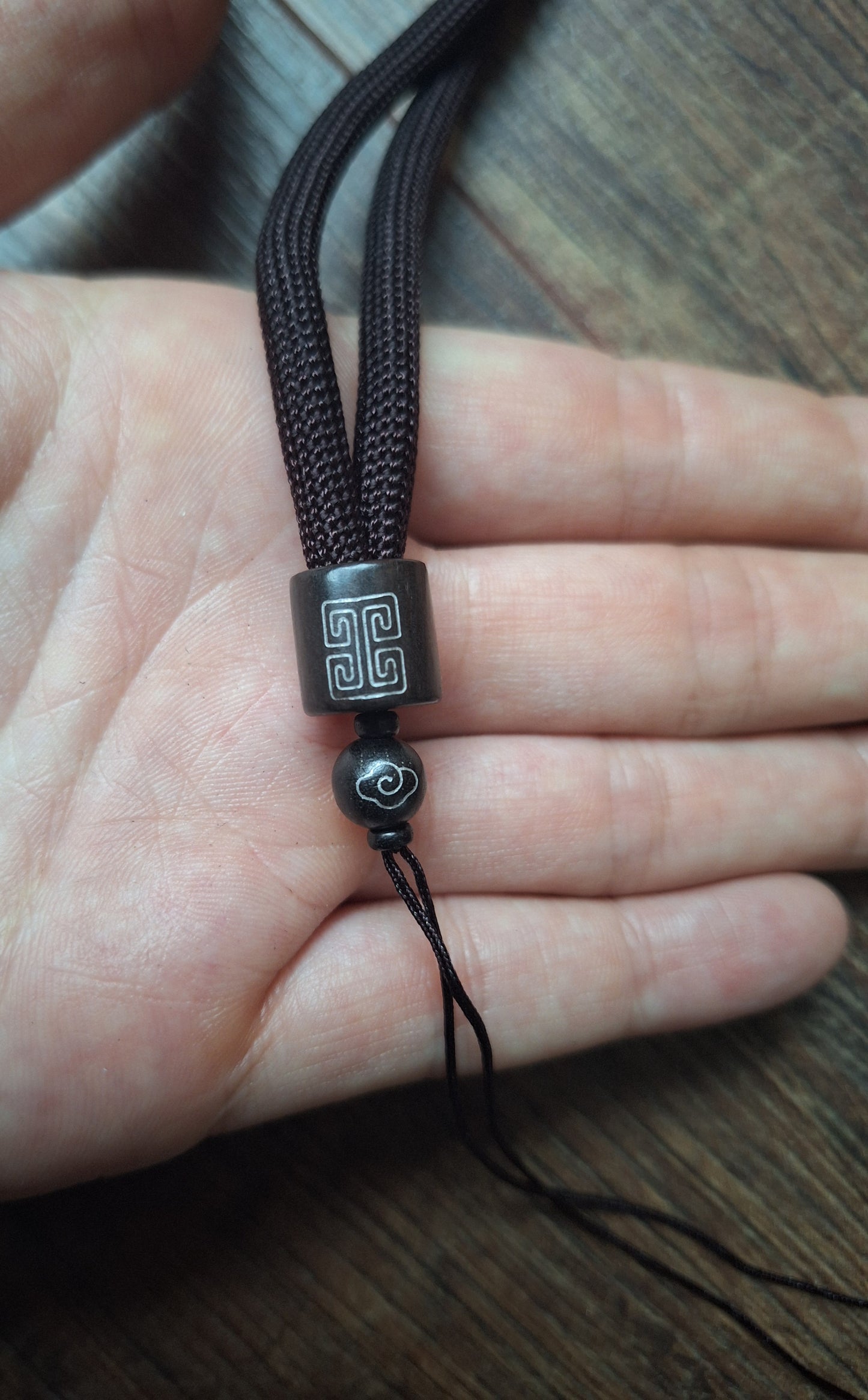 Amulet cord brown with shou symbol