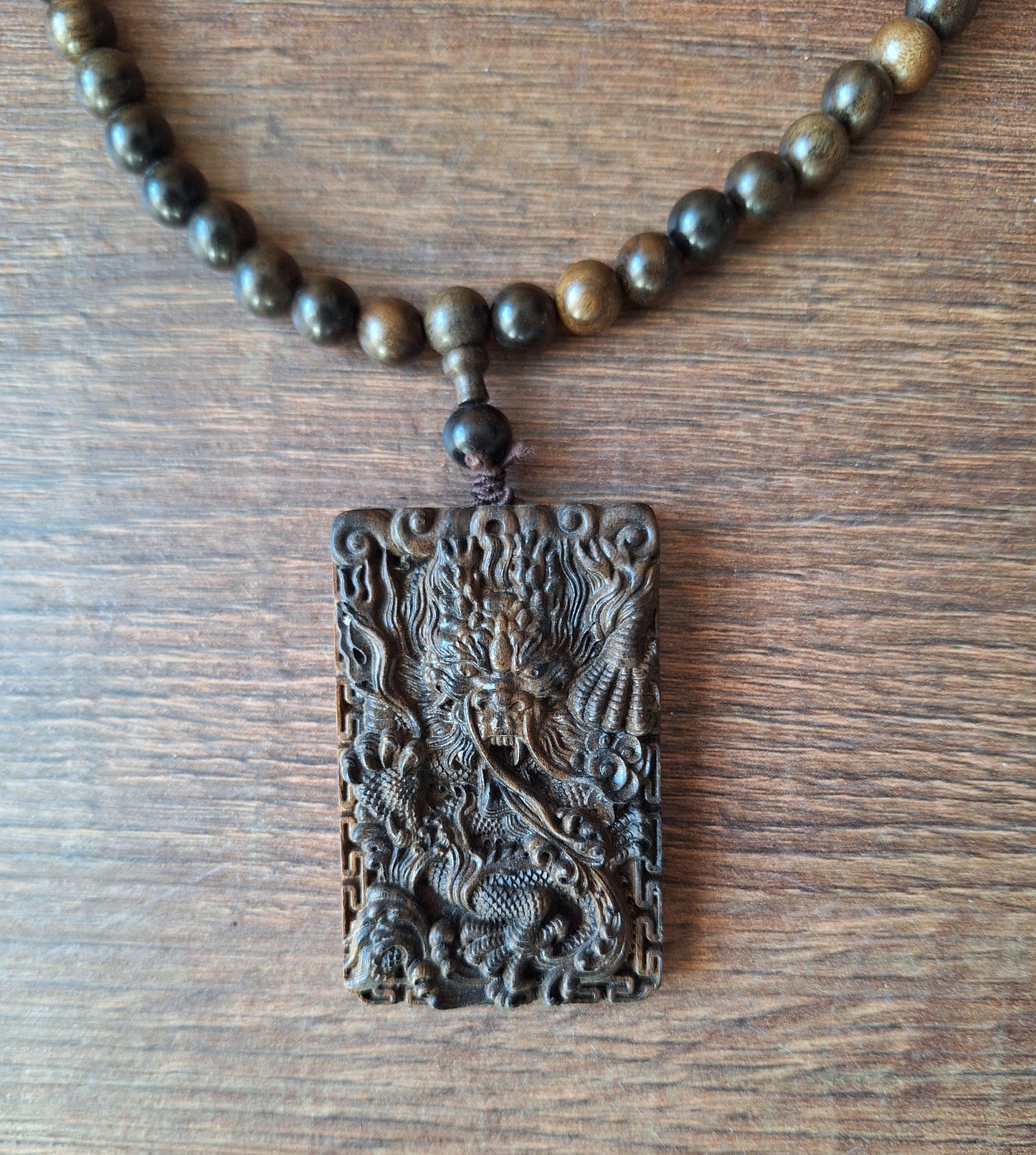 Agarwood mala with dragon pendant