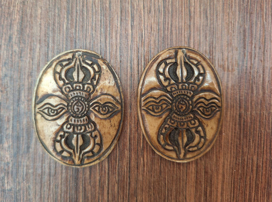 Vintage yak bone pendant Dorje with Buddha Eyes