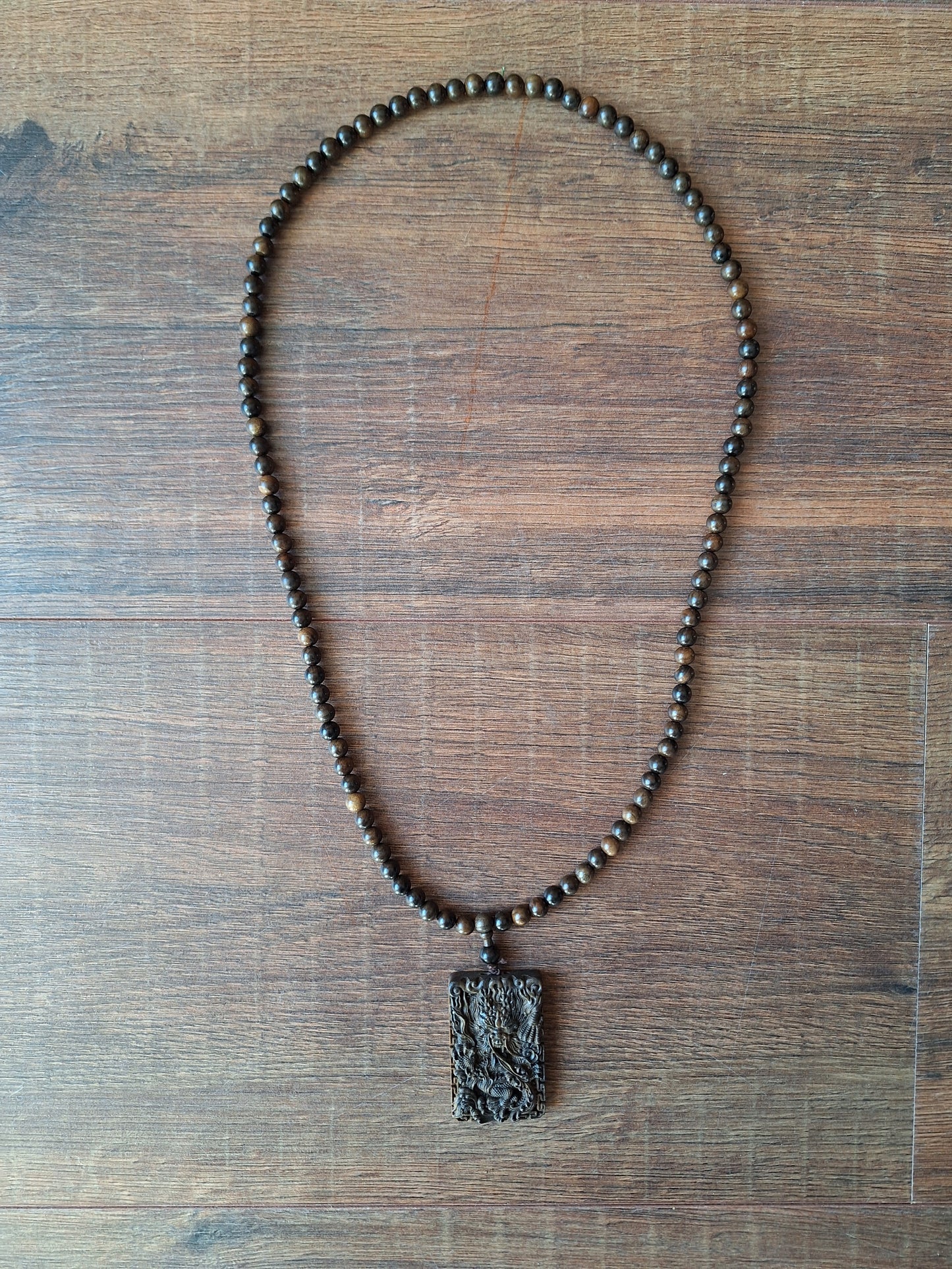Agarwood mala with dragon pendant