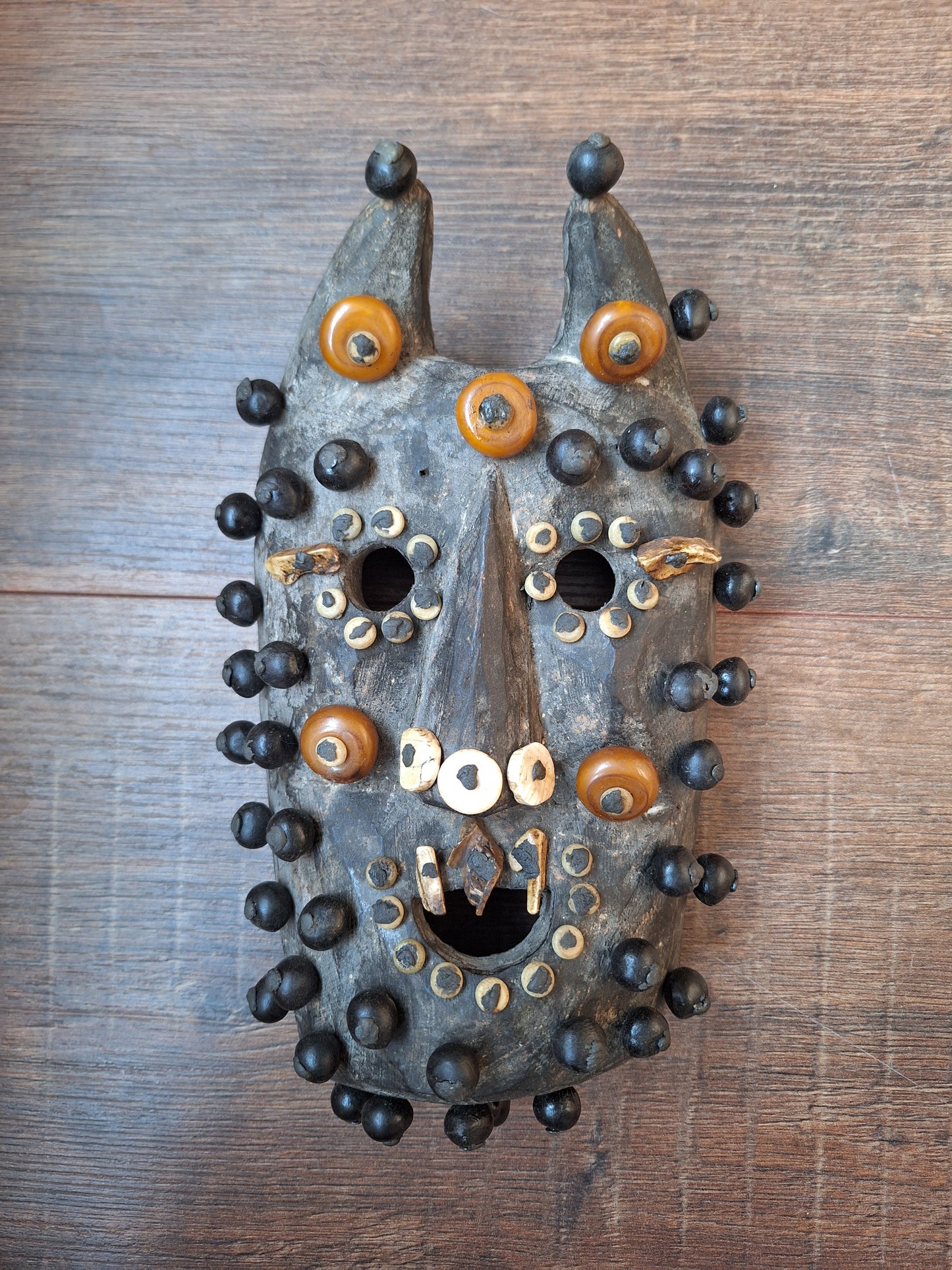 Old Nepalese wooden mask with rita, copal and shell beads