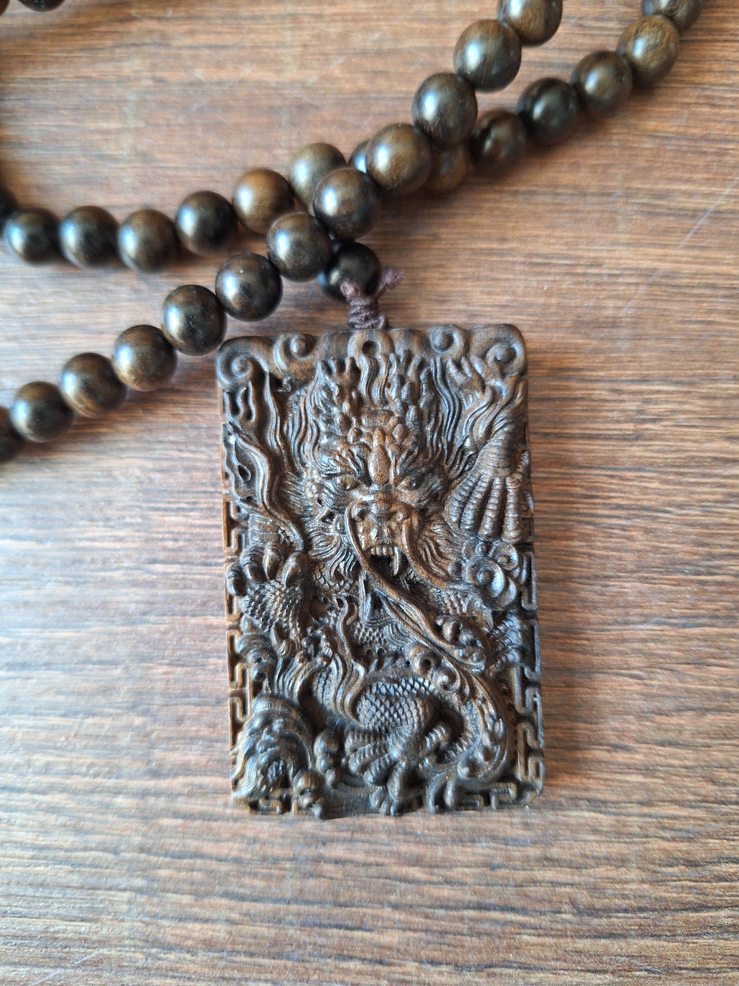Agarwood mala with dragon pendant