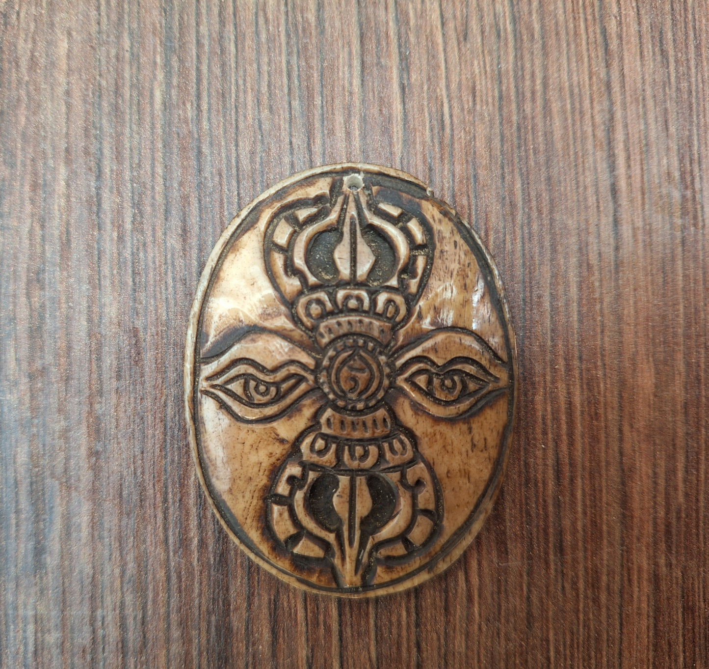 Vintage yak bone pendant Dorje with Buddha Eyes