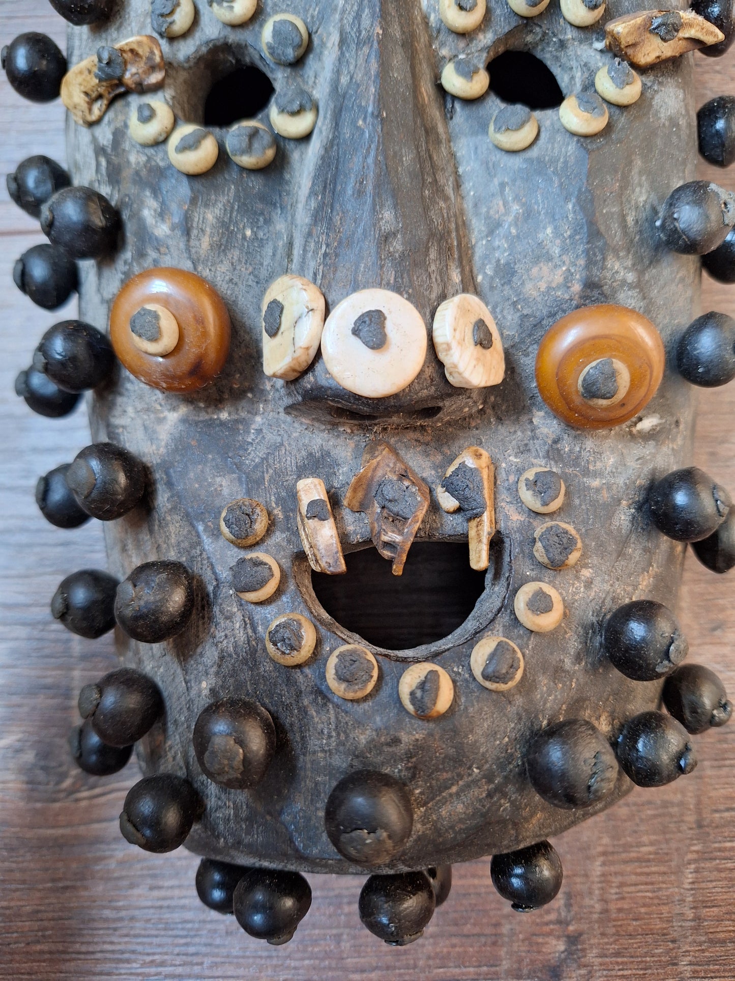 Old Nepalese wooden mask with rita, copal and shell beads