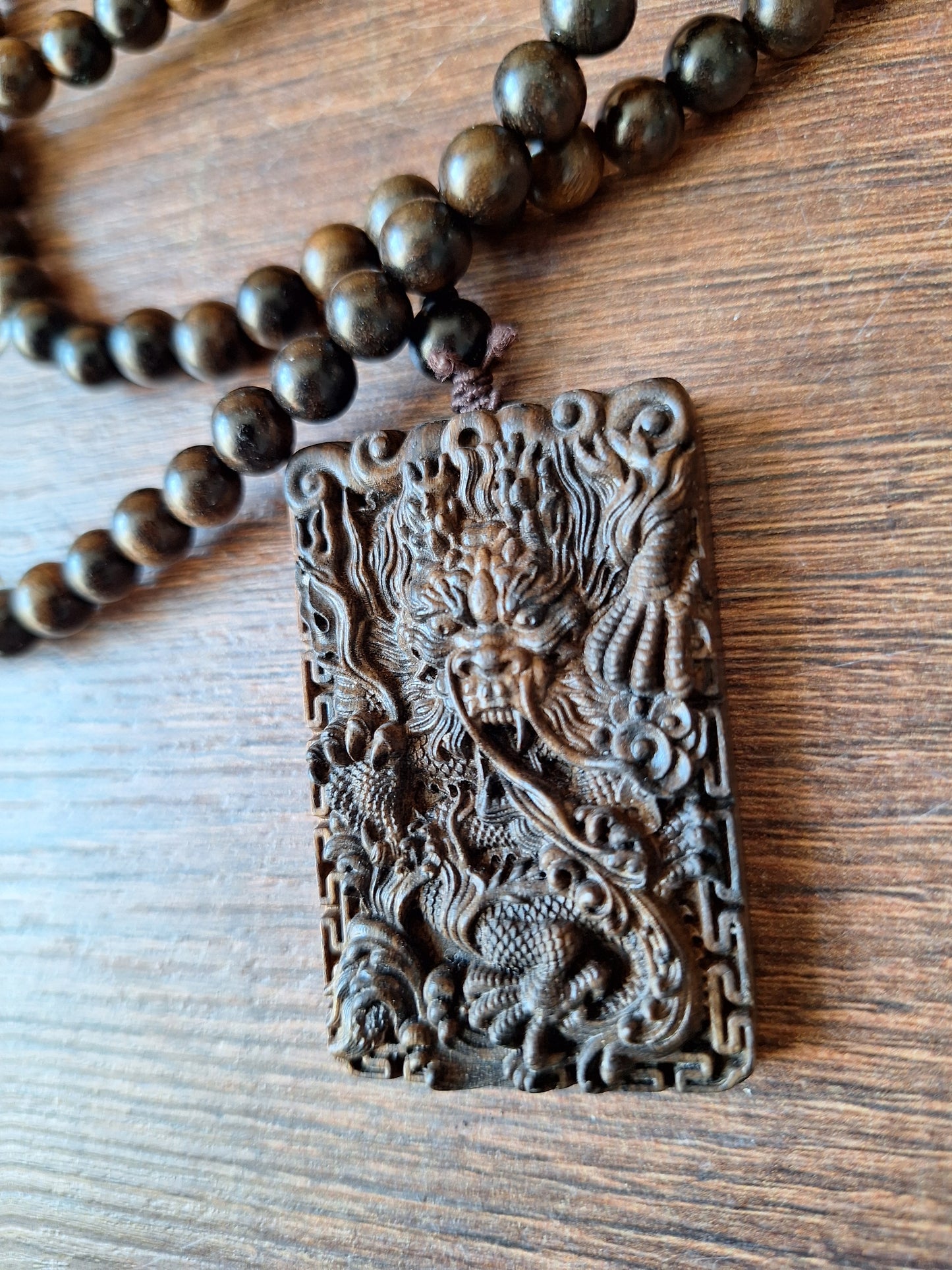 Agarwood mala with dragon pendant