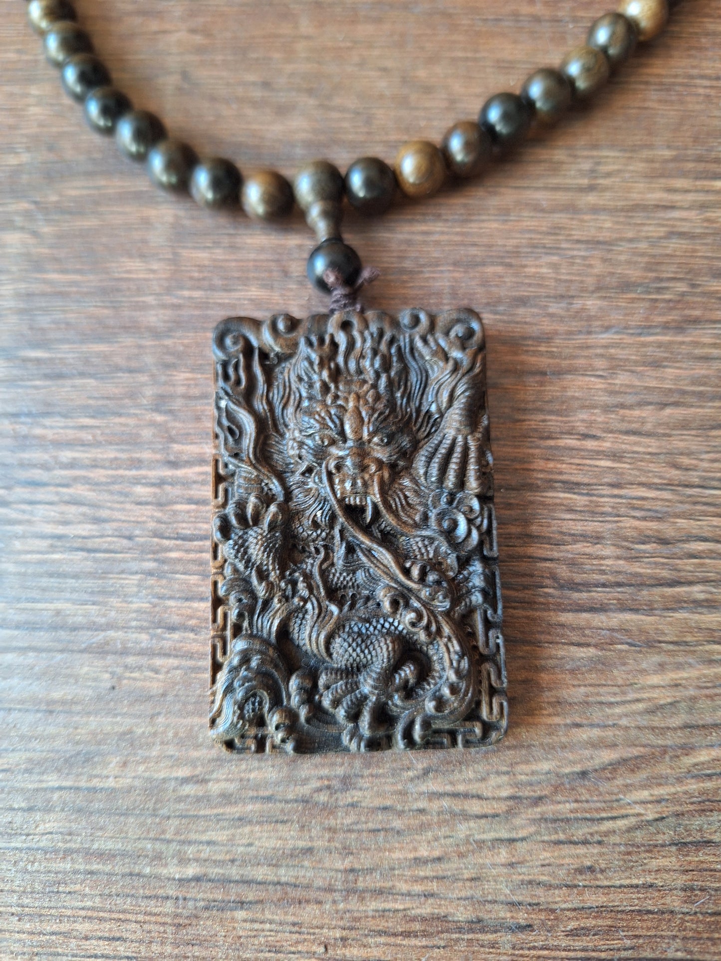 Agarwood mala with dragon pendant