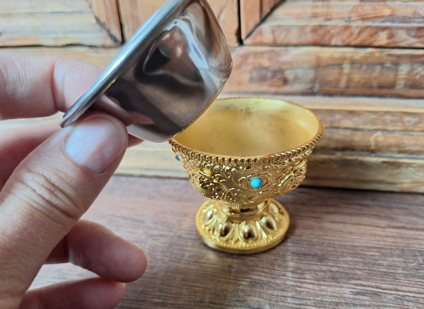 Gold coloured metal alloy offering bowl
