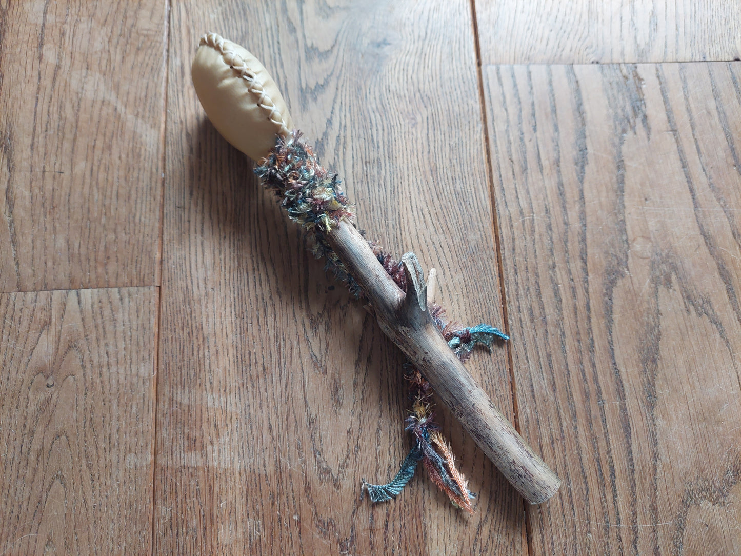 Goat hide and pine wood rattle