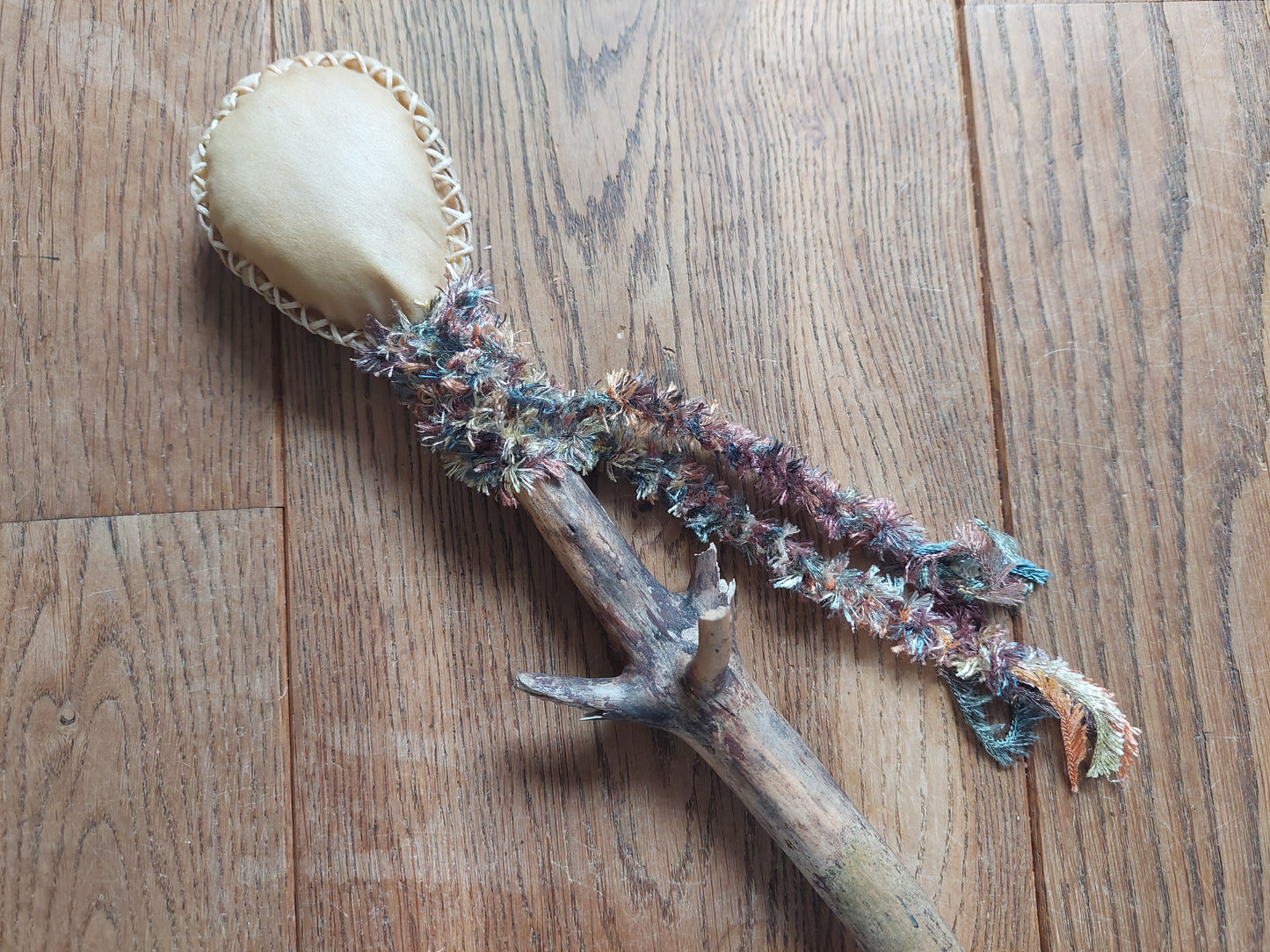 Goat hide and pine wood rattle