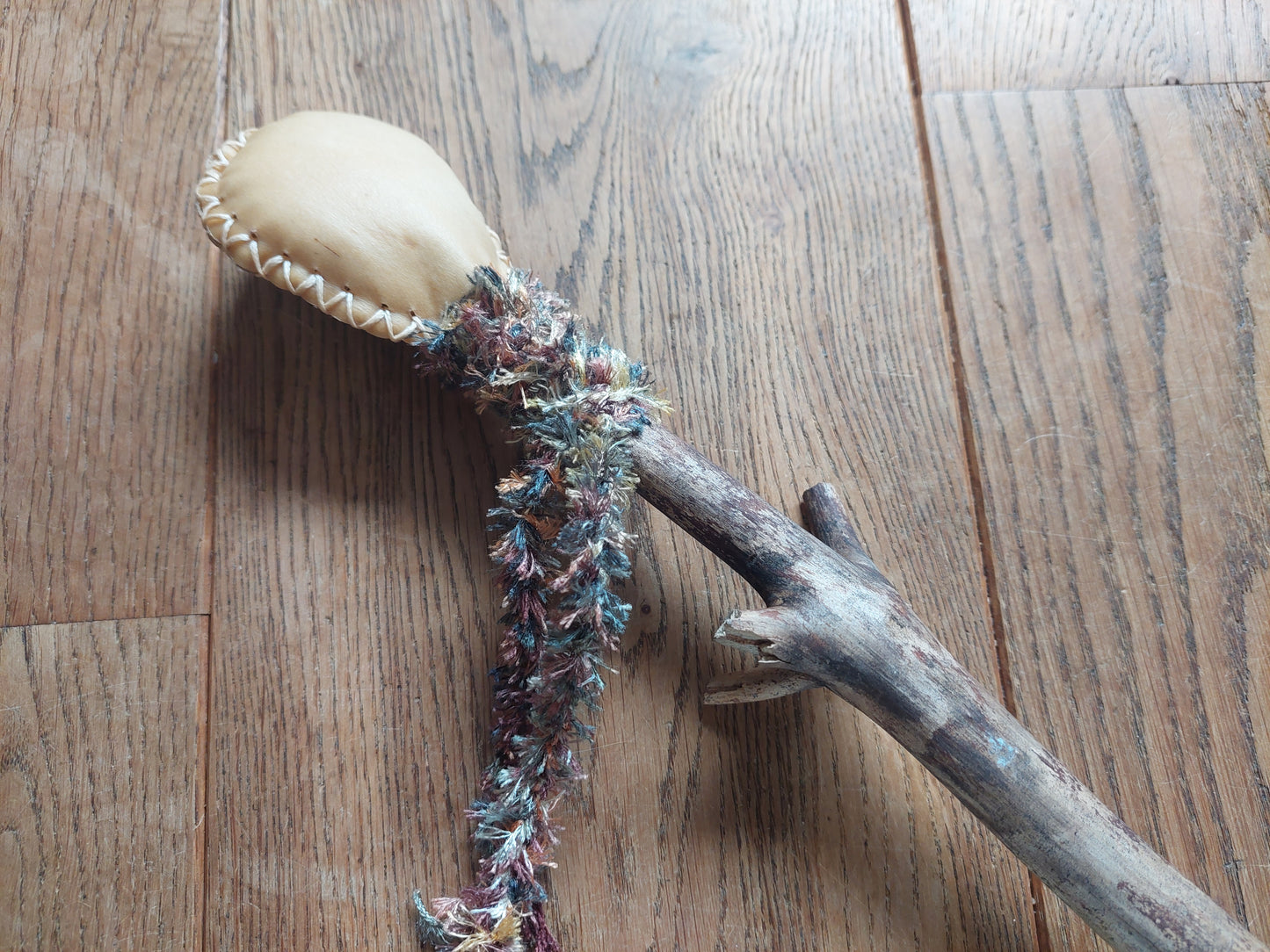 Goat hide and pine wood rattle