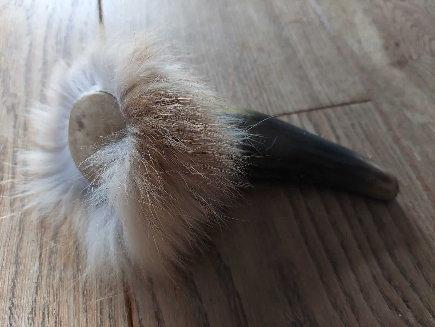 Cow horn and fox fur rattle