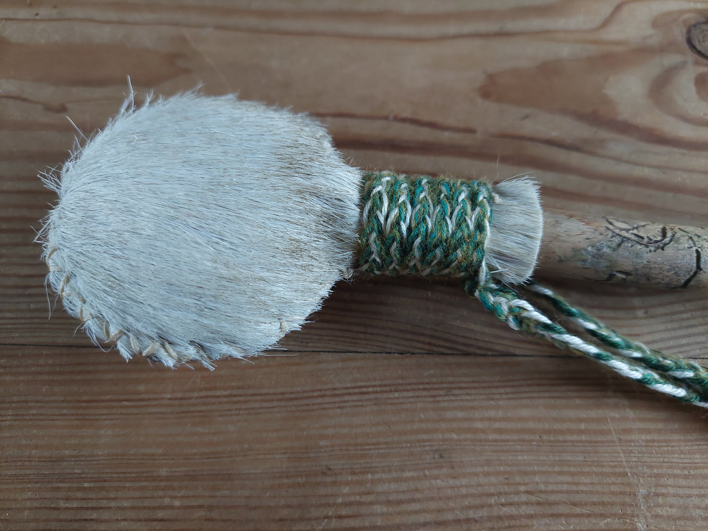 Horse hide, badger paw and pine wood rattle