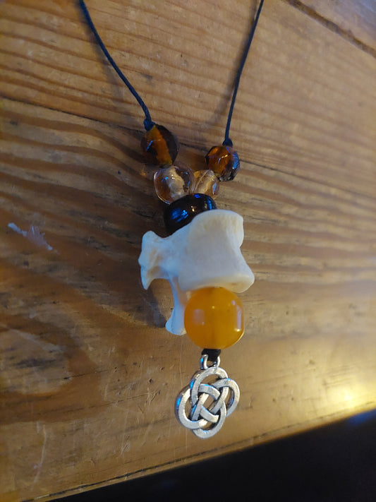 Fox vertebra with old beeswax amber bead and endless knot amulet necklace