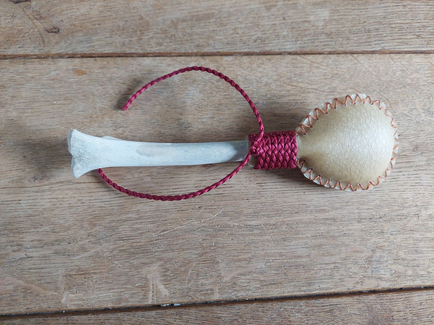 Red deer hide and roe deer leg bone rattle