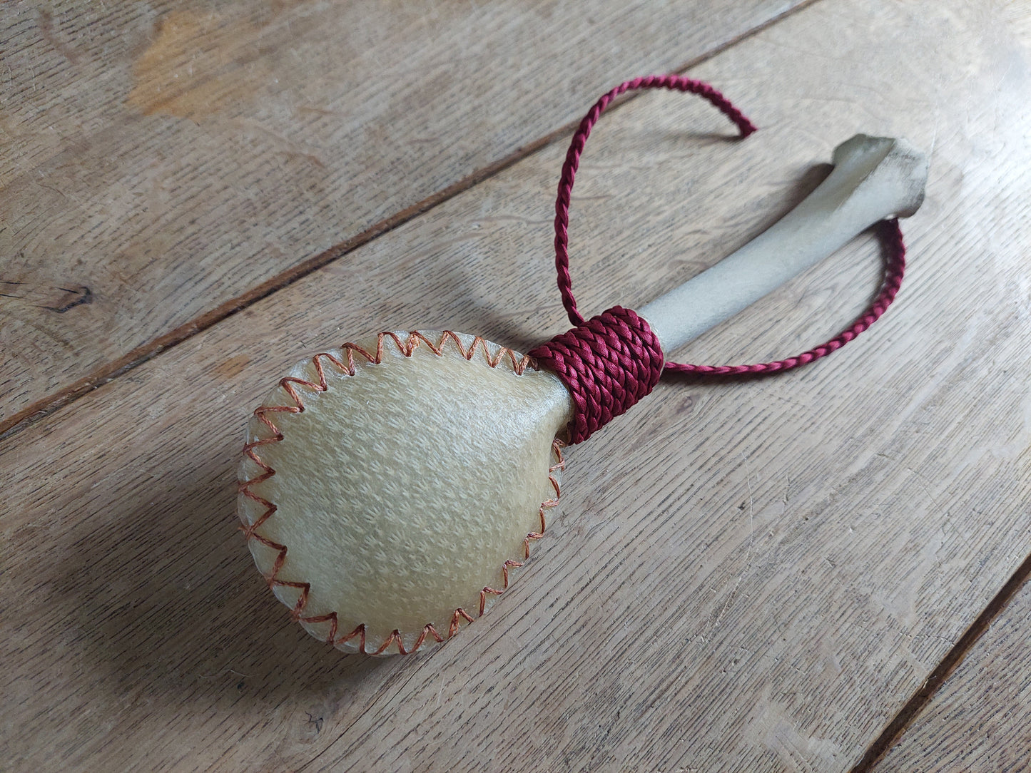 Red deer hide and roe deer leg bone rattle