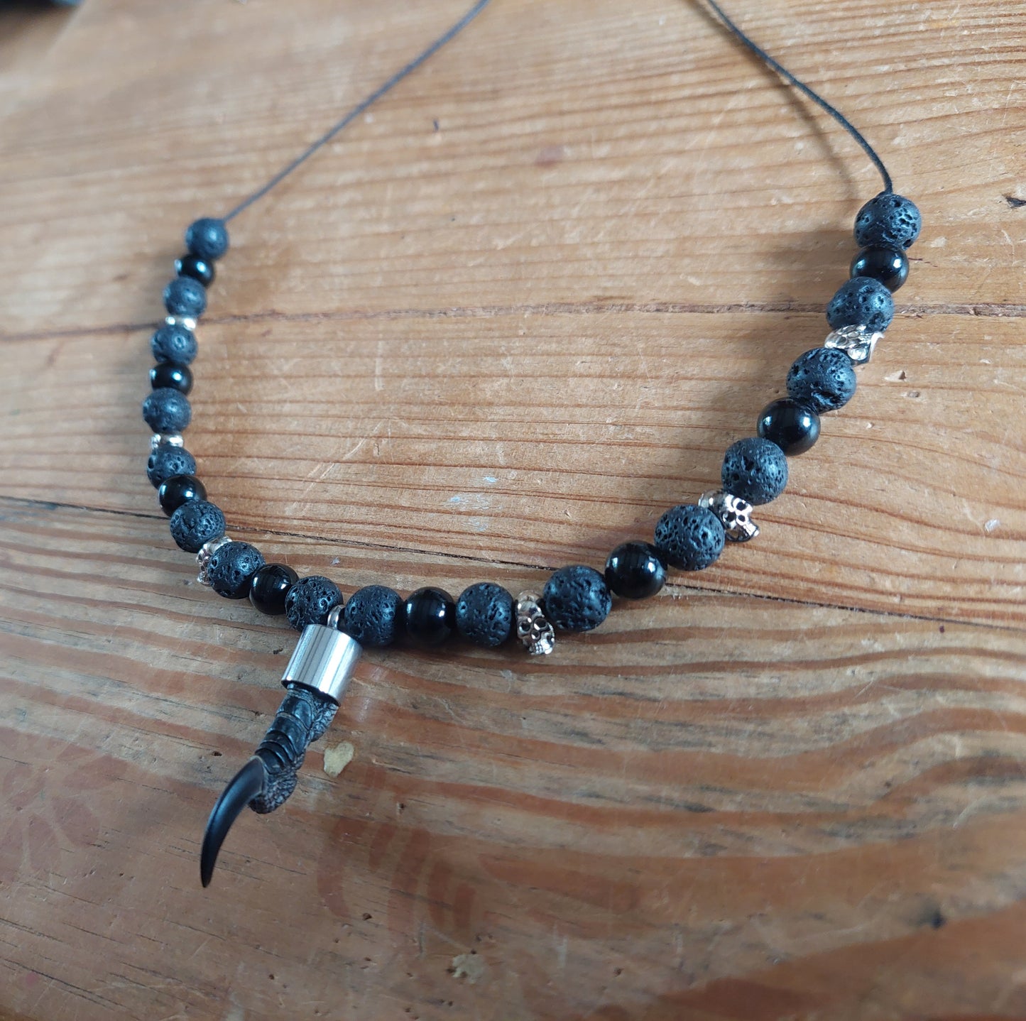 Crow nail with lava stone and obsidian amulet necklace