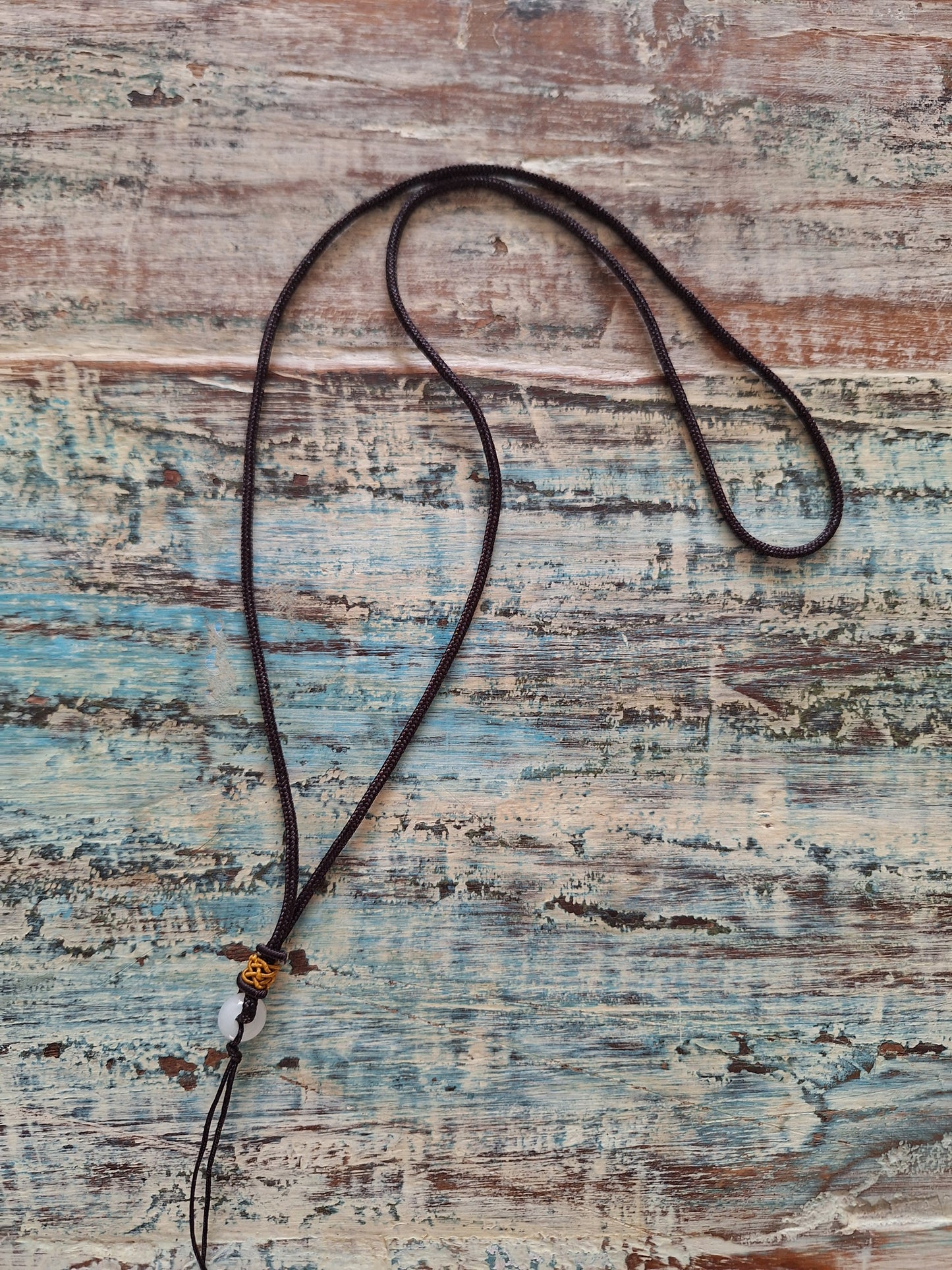 Amulet cord brown with jade bead