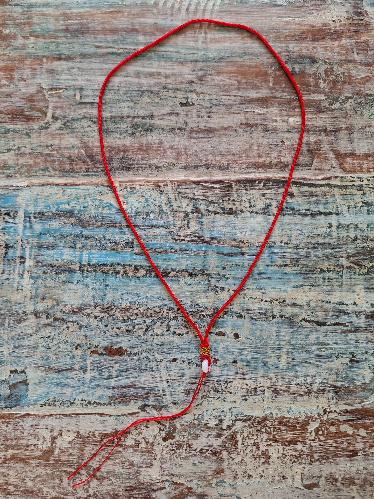 Amulet cord red with jade bead