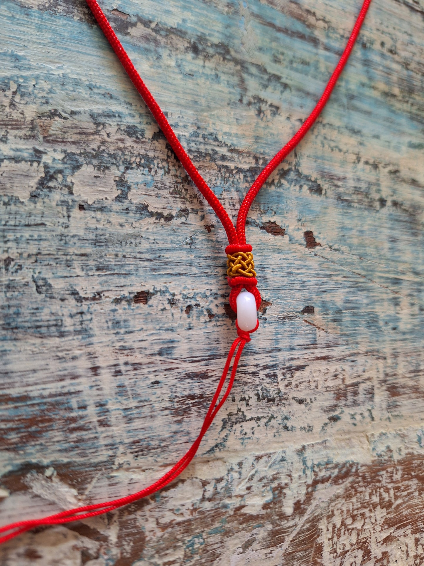 Amulet cord red with jade bead