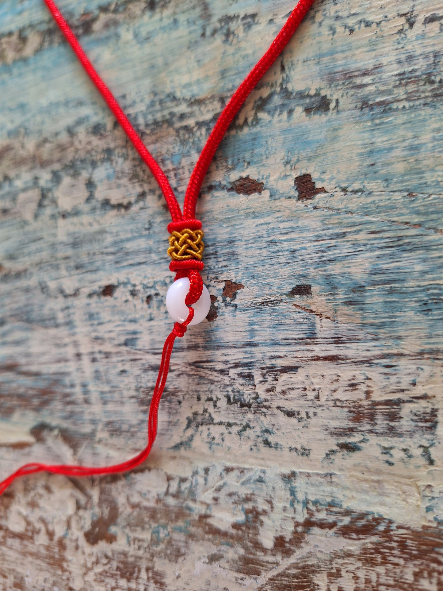 Amulet cord red with jade bead