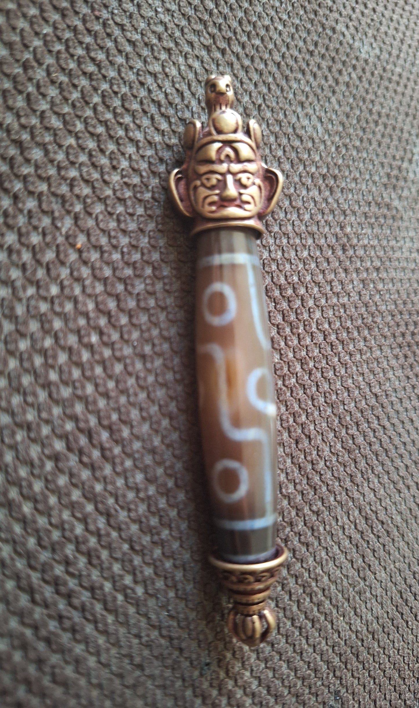 9 eye dzi bead and Hayagriva pendant