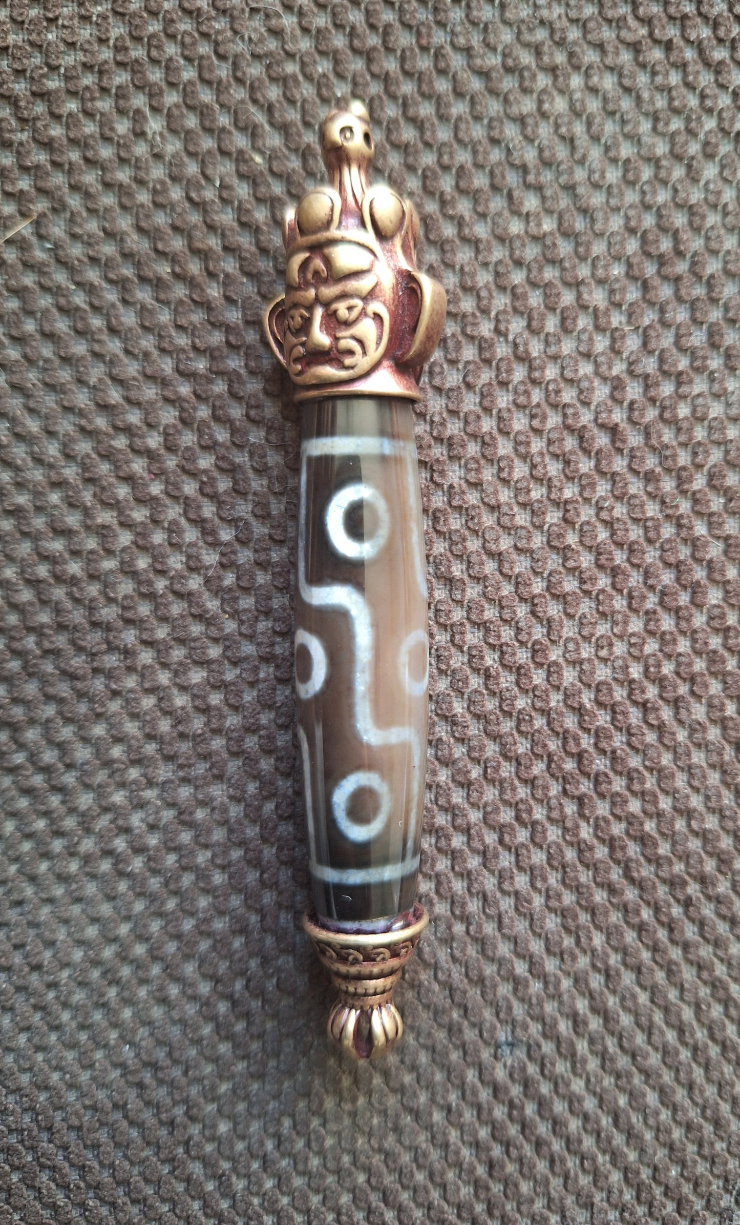 9 eye dzi bead and Hayagriva pendant