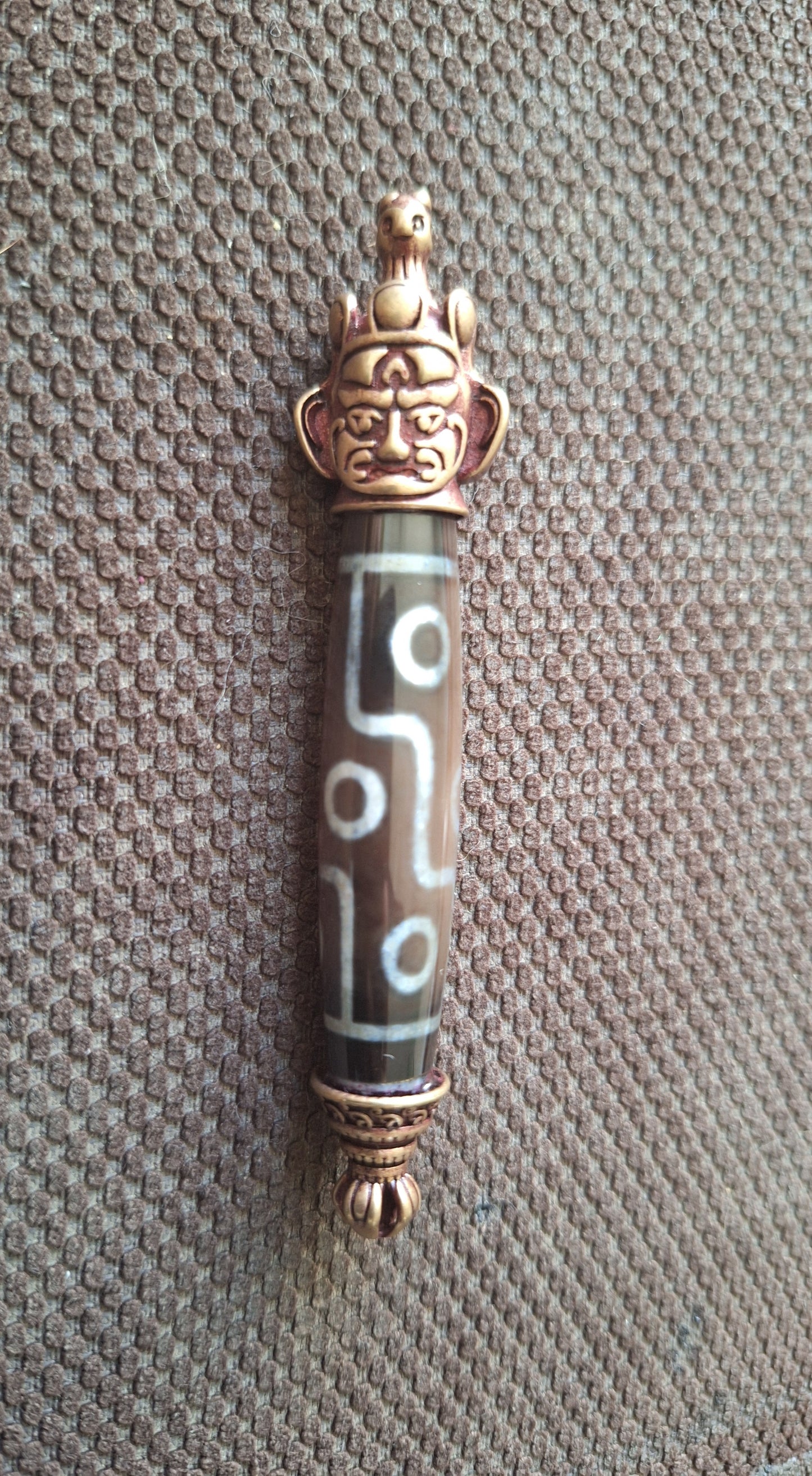 9 eye dzi bead and Hayagriva pendant
