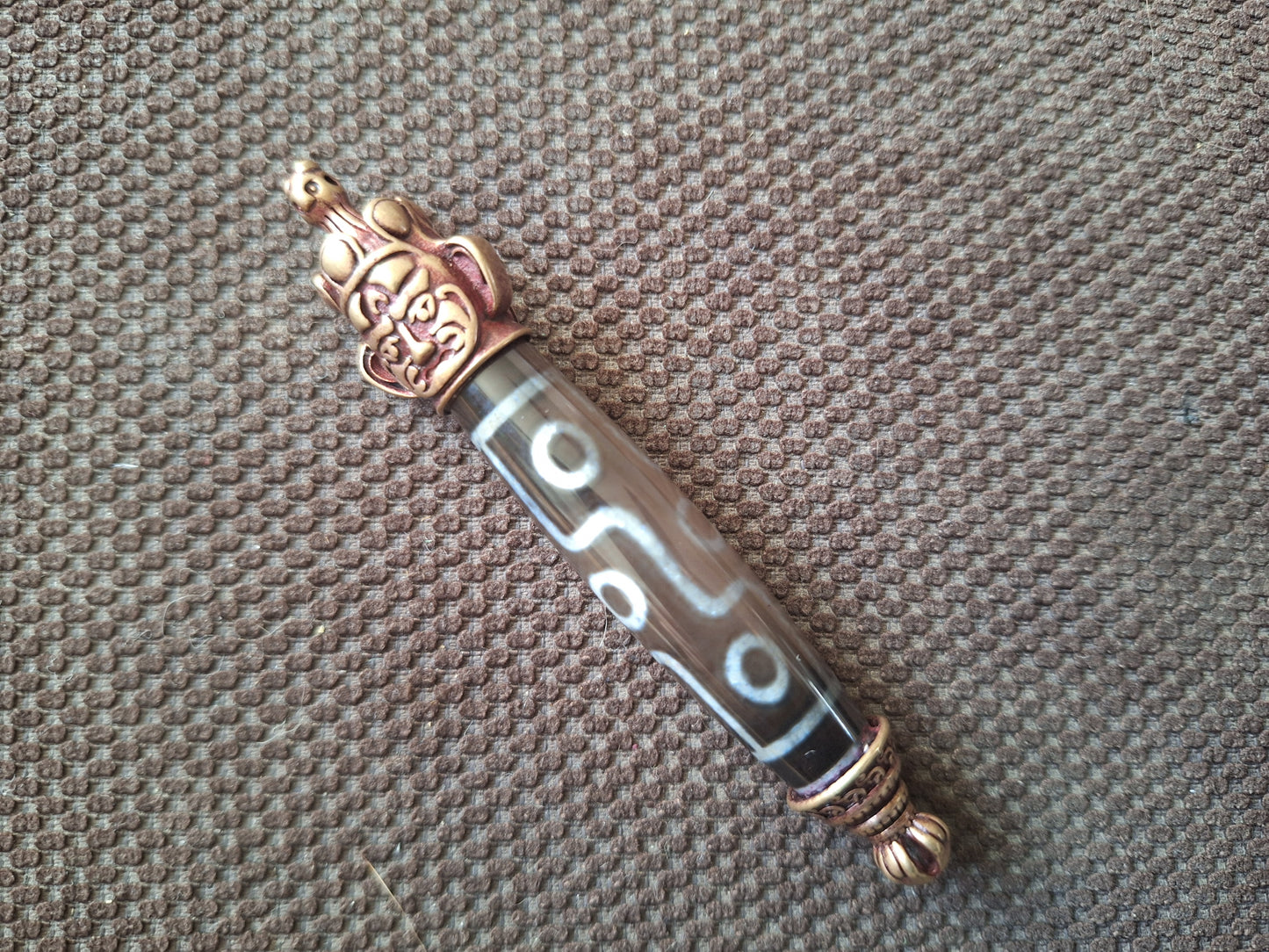 9 eye dzi bead and Hayagriva pendant