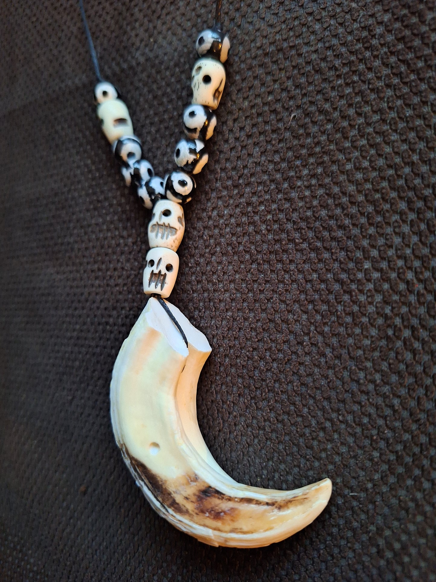 Wild boar tusk with yak bone skull beads amulet necklace