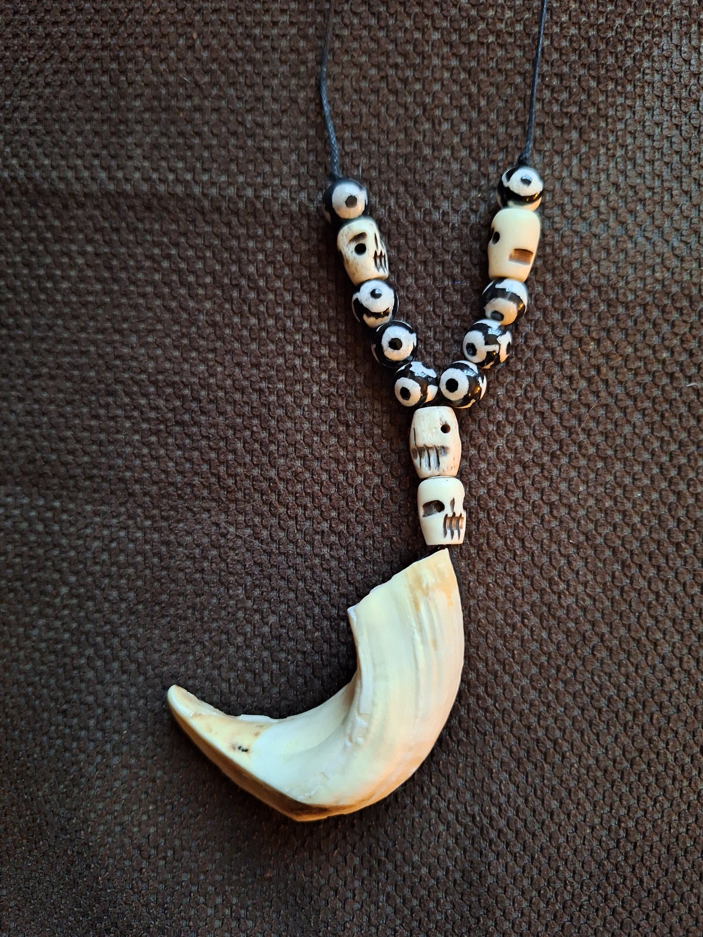 Wild boar tusk with yak bone skull beads amulet necklace