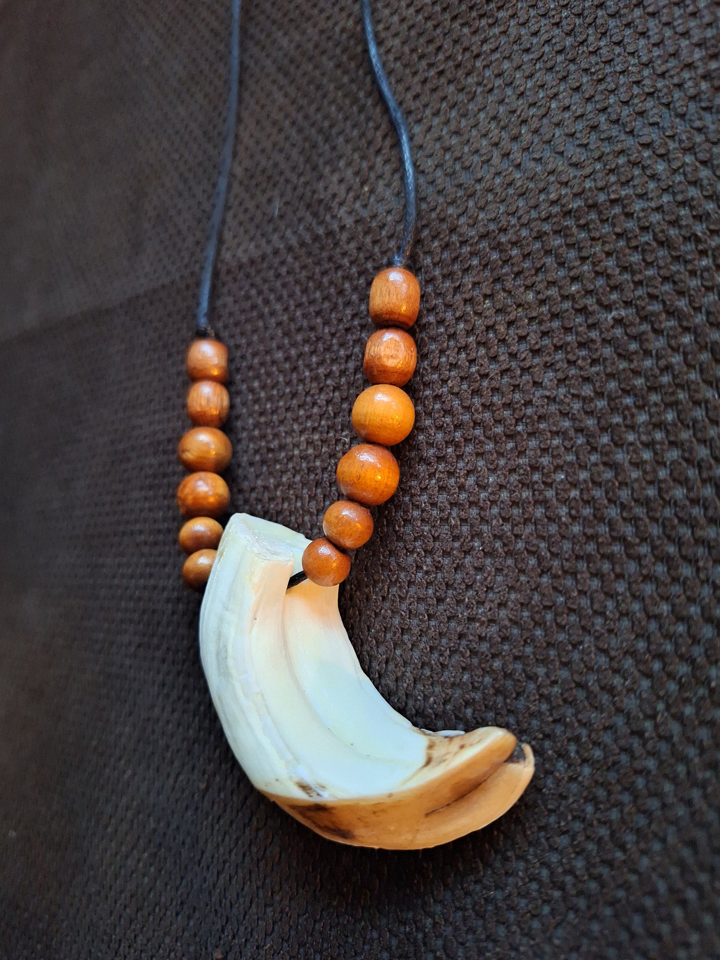 Wild boar tusk amulet necklace