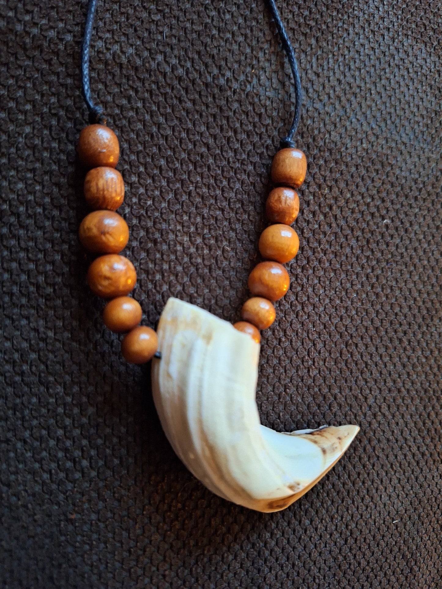 Wild boar tusk amulet necklace