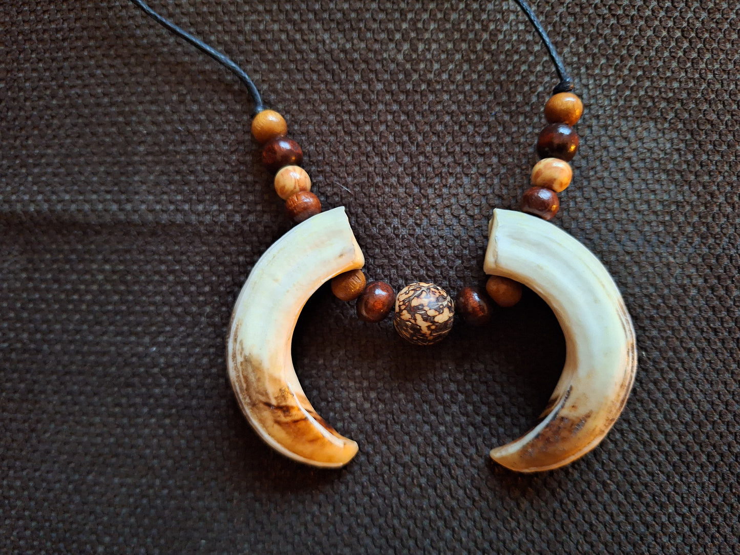 Wild boar tusks amulet necklace