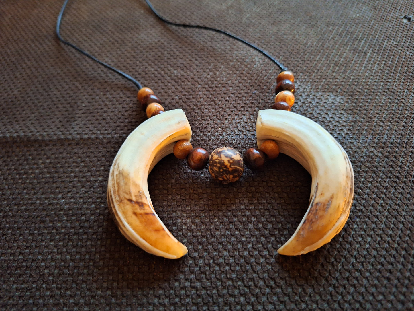 Wild boar tusks amulet necklace