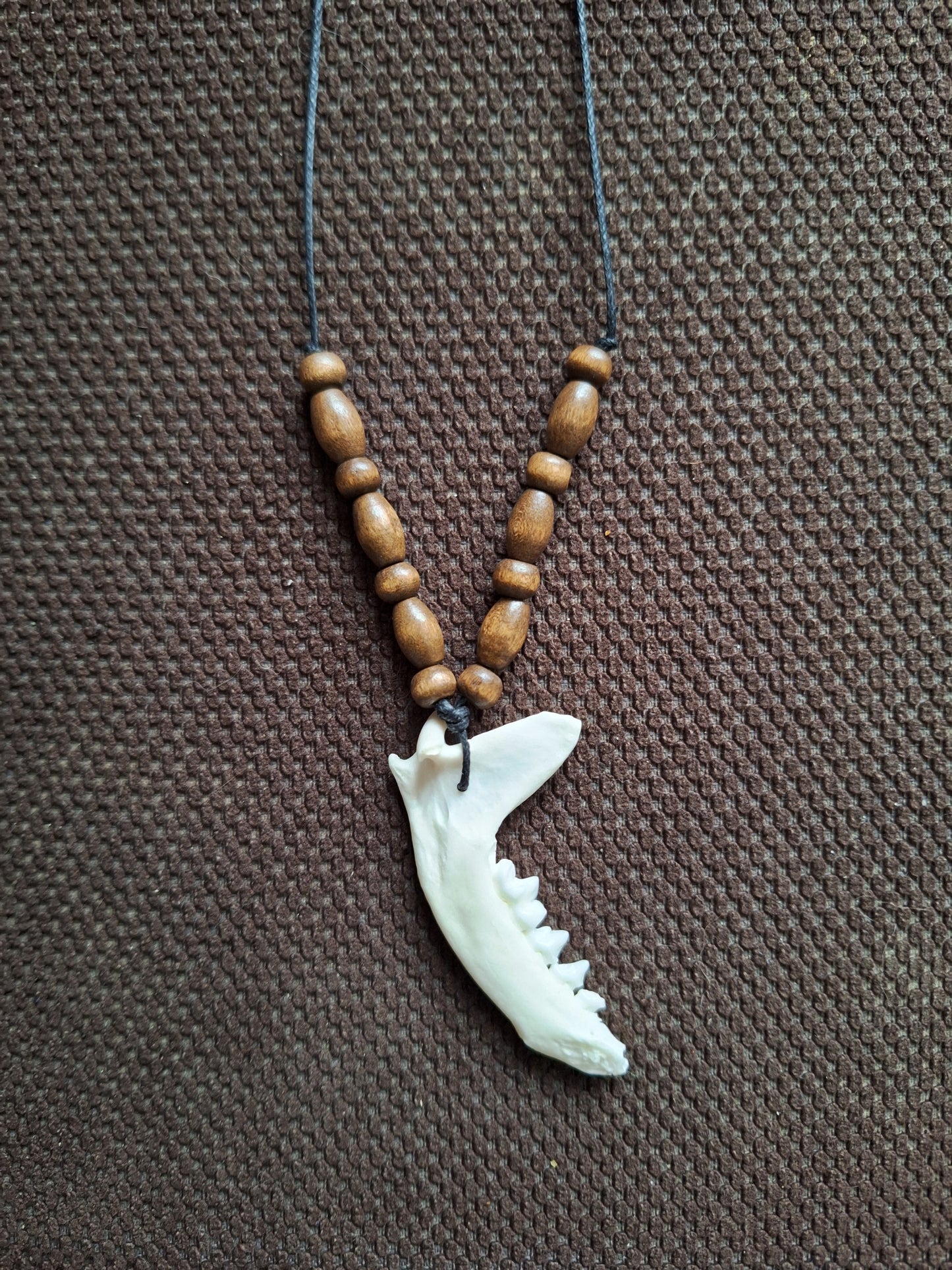 Marten jaw bone and wooden beads amulet necklace