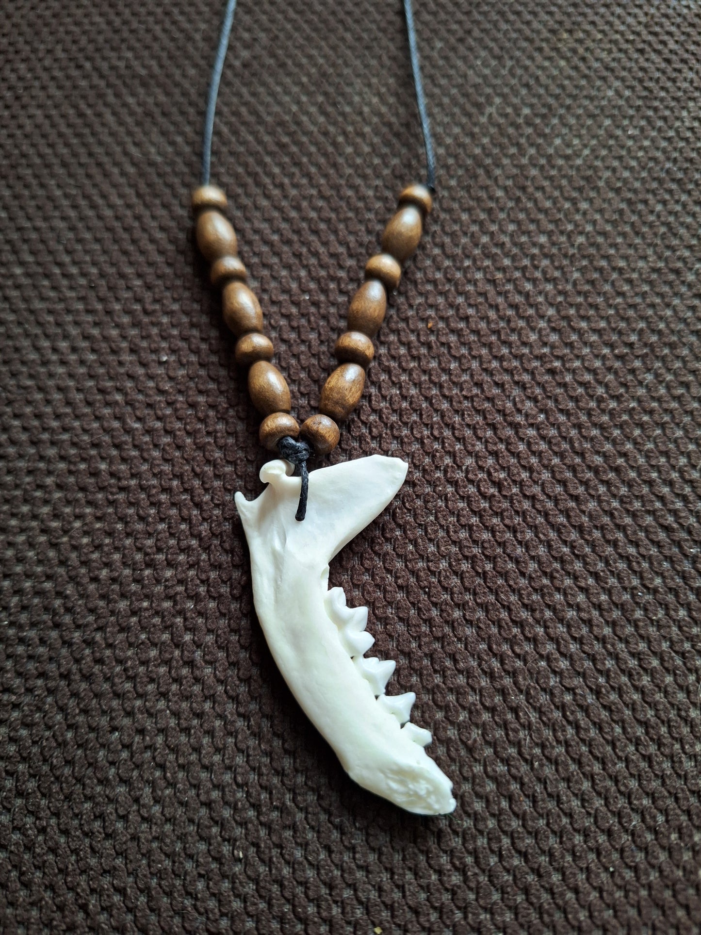 Marten jaw bone and wooden beads amulet necklace