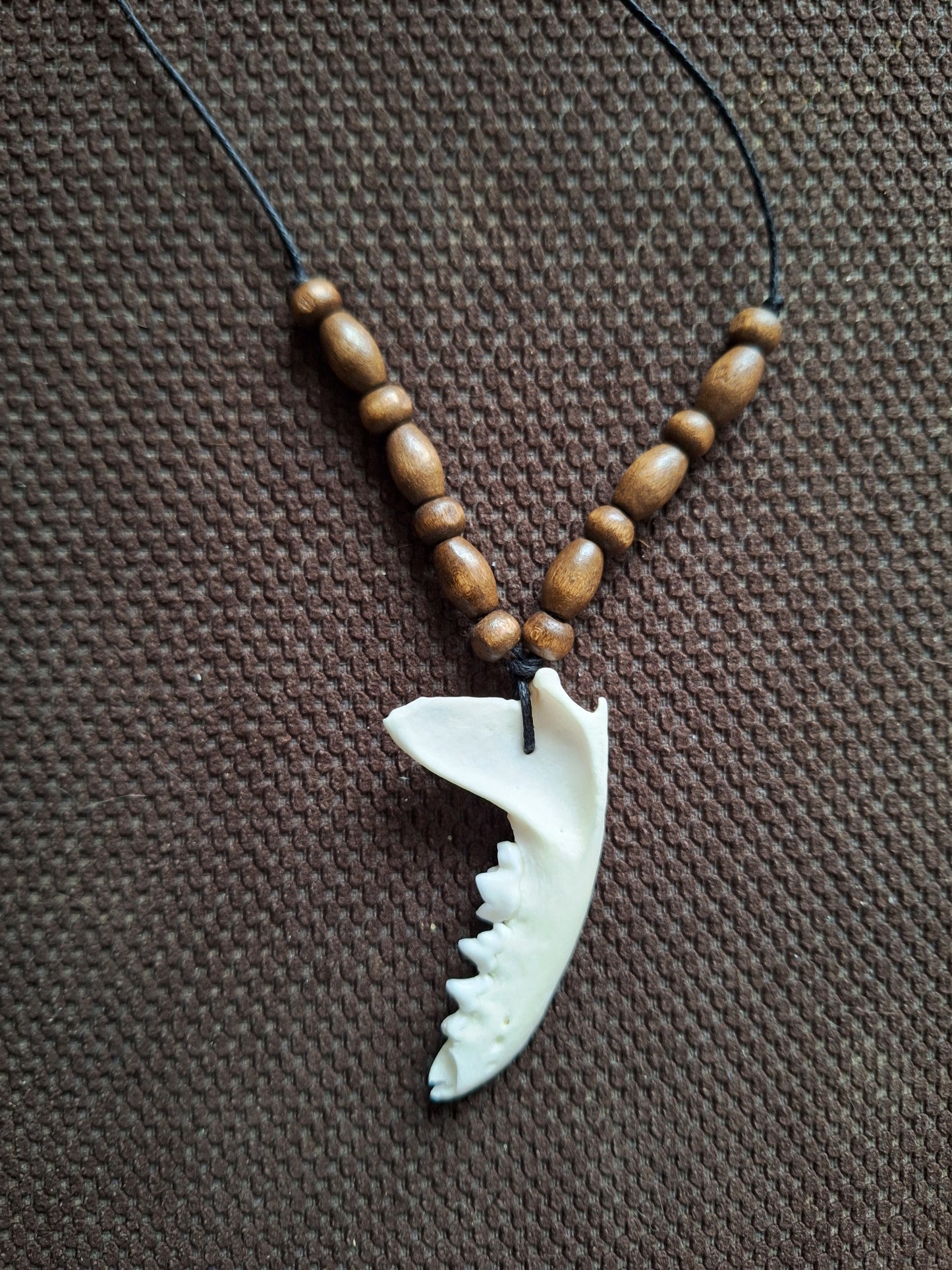 Marten jaw bone and wooden beads amulet necklace