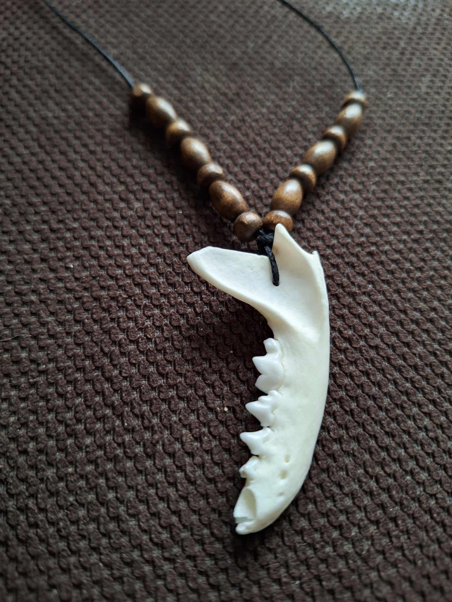 Marten jaw bone and wooden beads amulet necklace