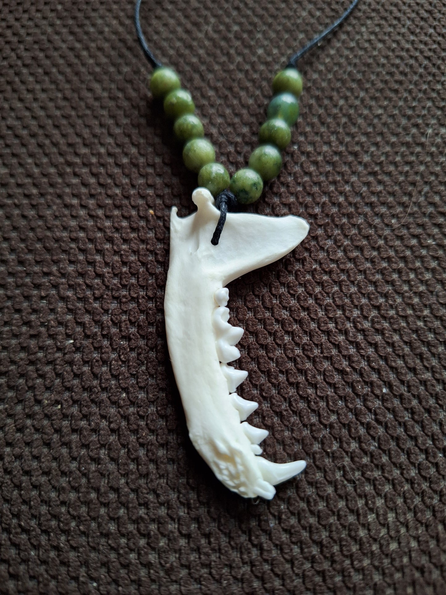 Marten jaw bone and jade amulet necklace