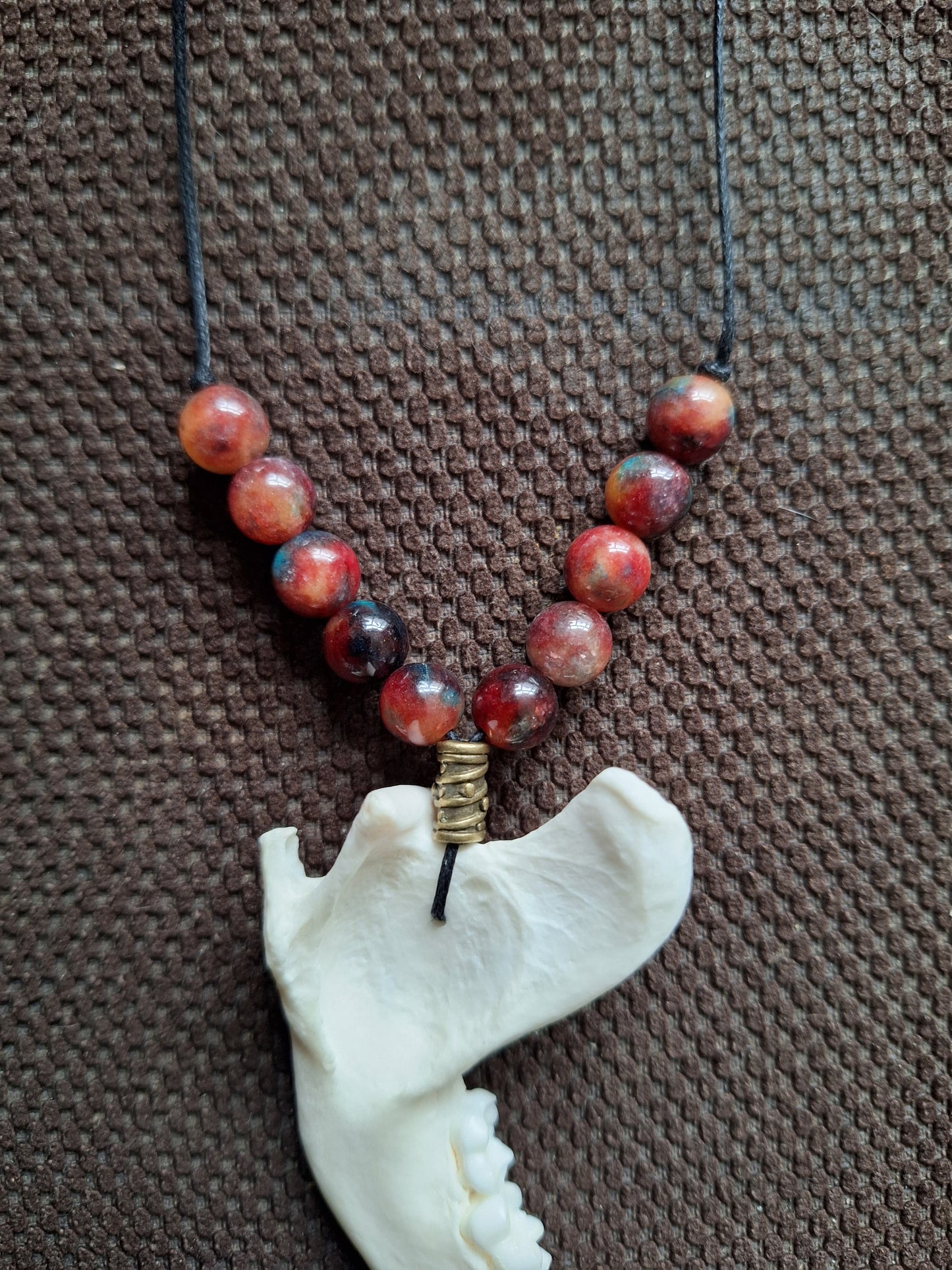 Racoon jaw bone and dragon's blood stone amulet necklace #1