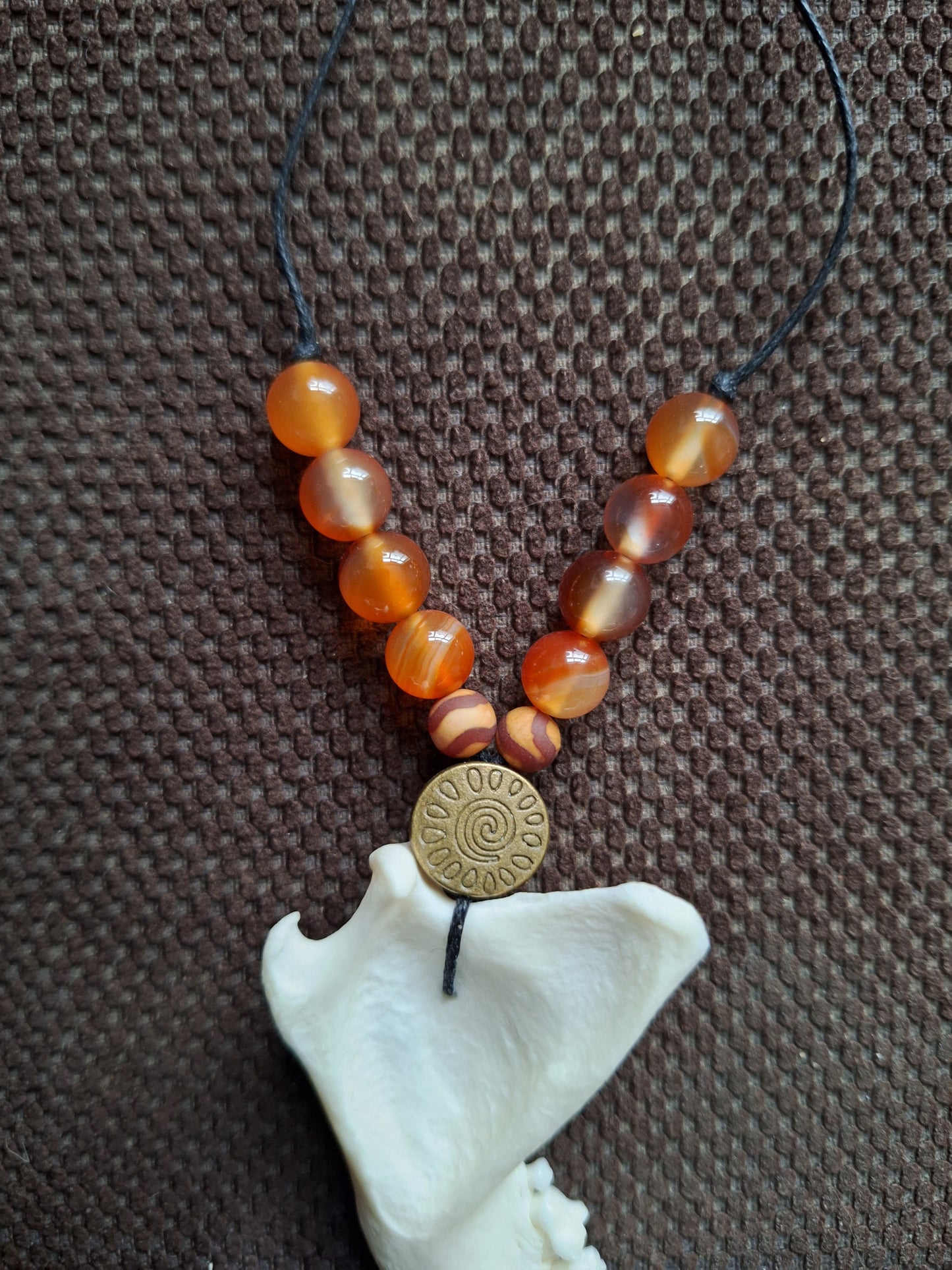 Fox jaw bone and carnelian amulet necklace