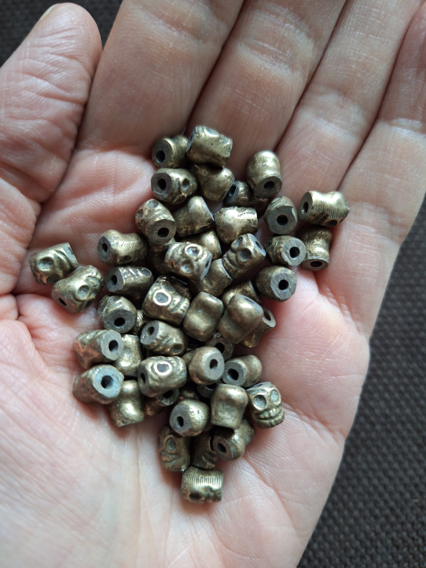 Vintage bronze skull beads, set of 10