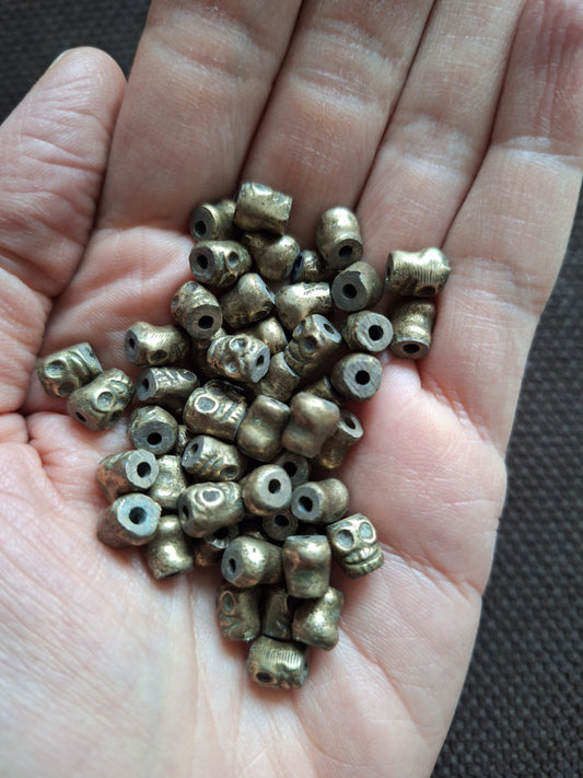 Vintage bronze skull beads