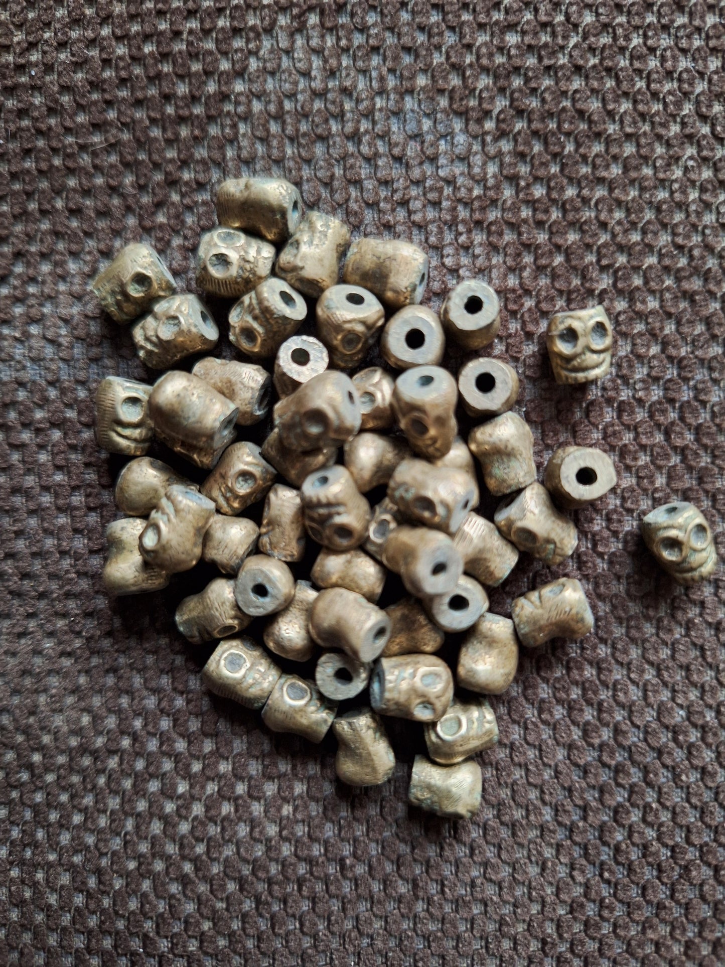 Vintage bronze skull beads, set of 10