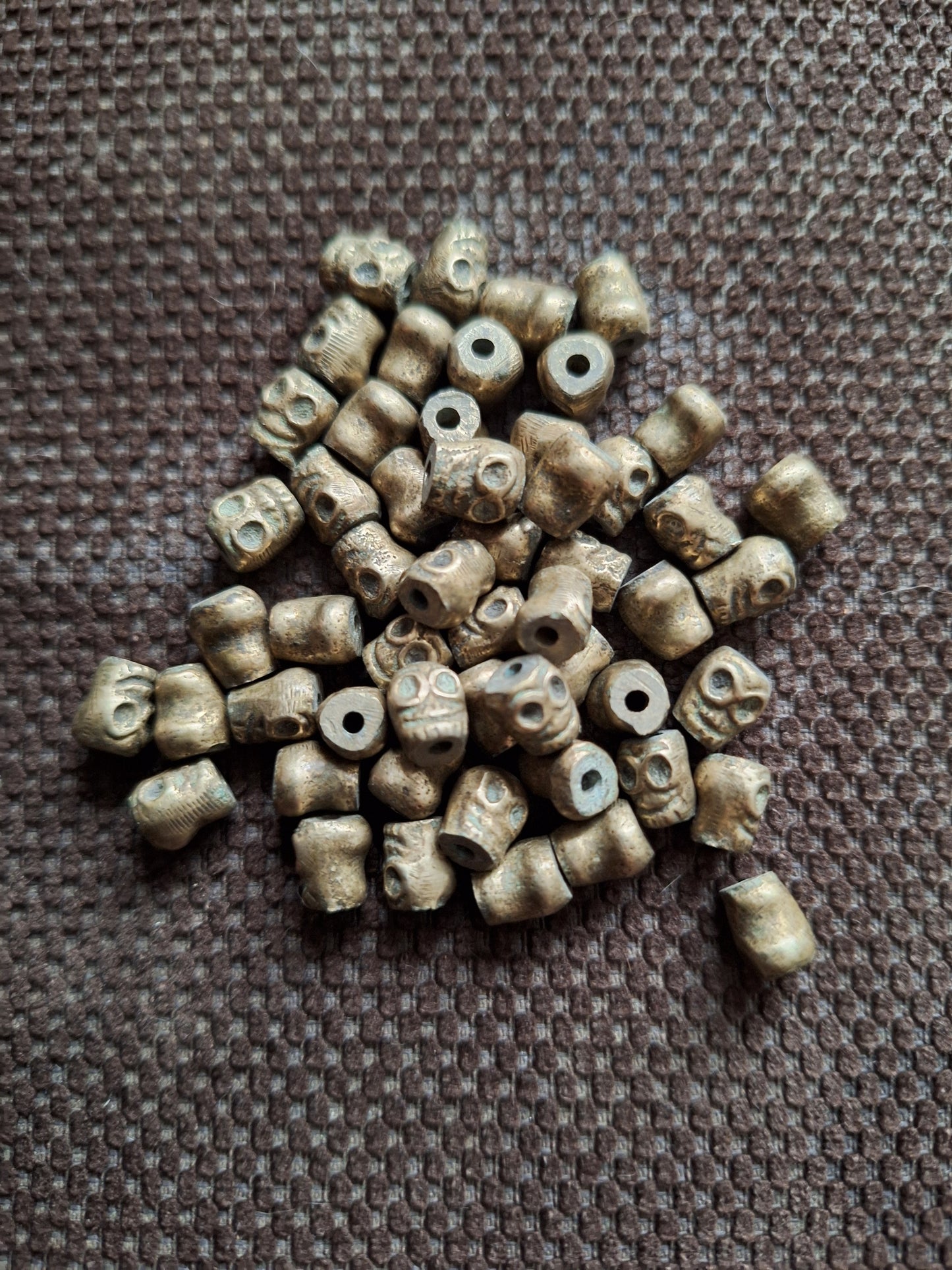 Vintage bronze skull beads, set of 10
