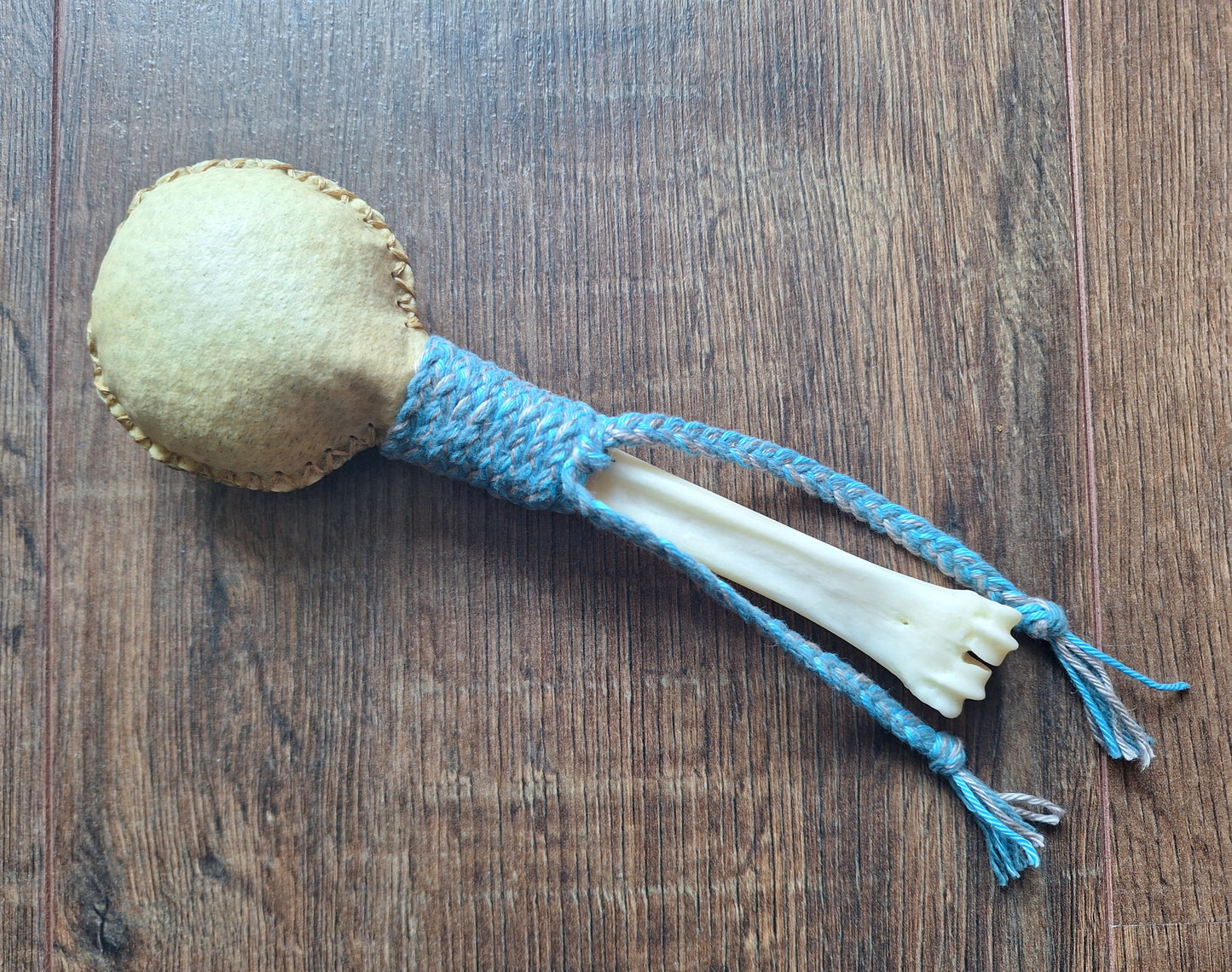 Wild boar hide and red deer leg bone rattle