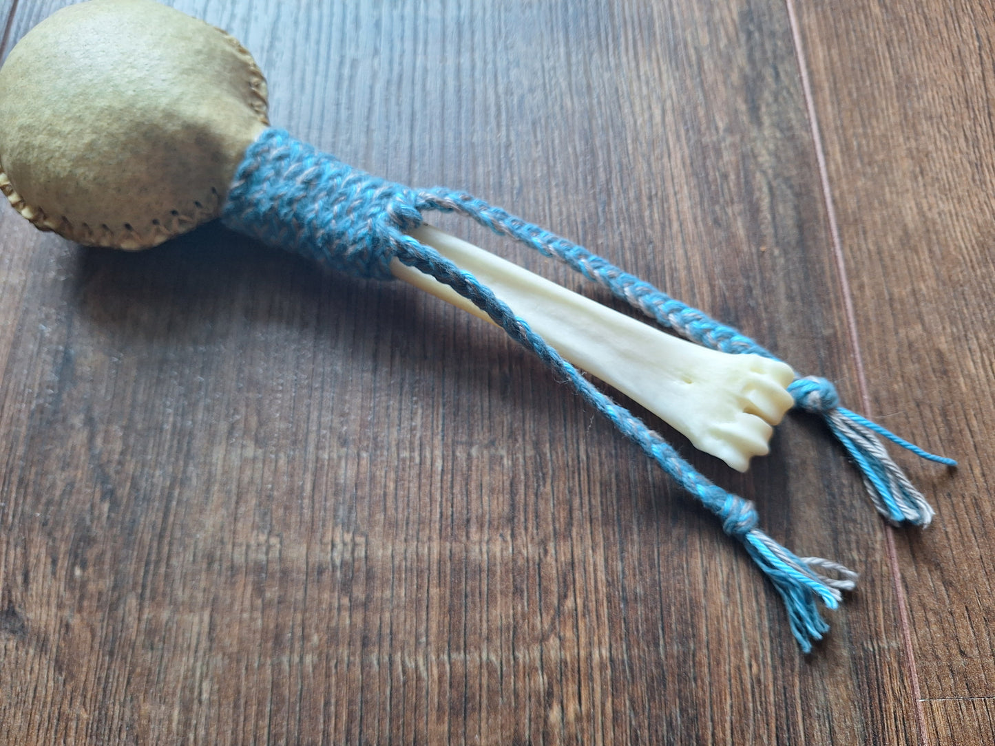 Wild boar hide and red deer leg bone rattle