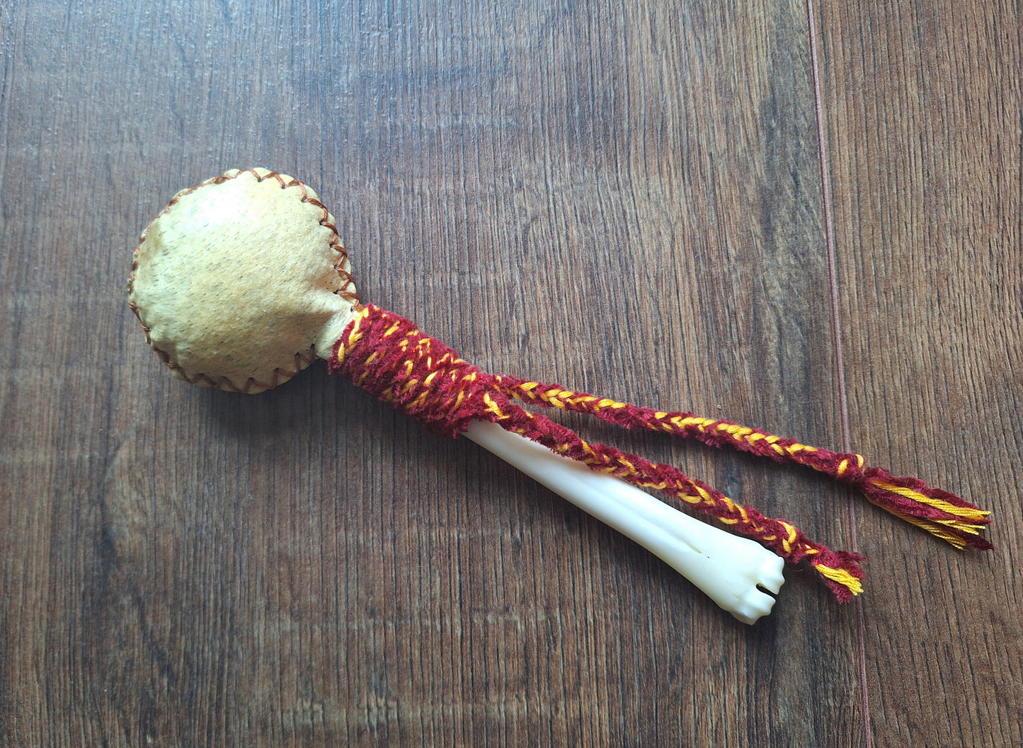 Wild boar hide and roe deer leg bone rattle