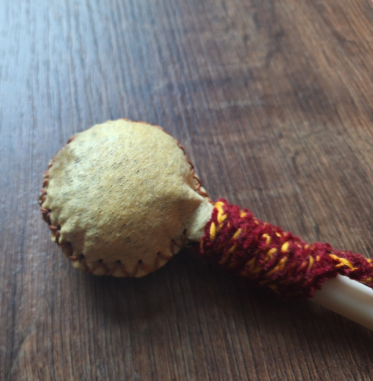 Wild boar hide and roe deer leg bone rattle