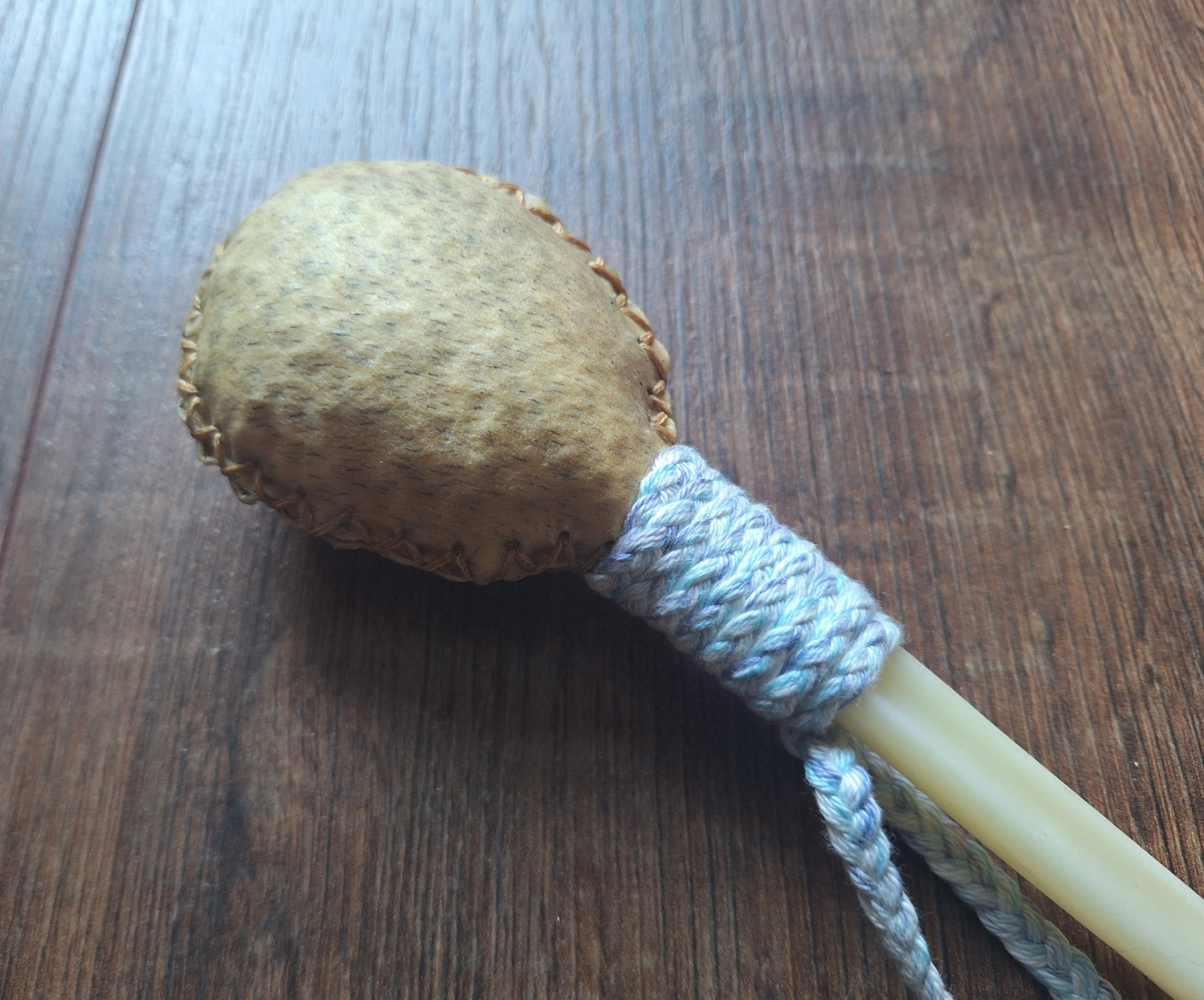 Wild boar hide and roe deer leg bone rattle